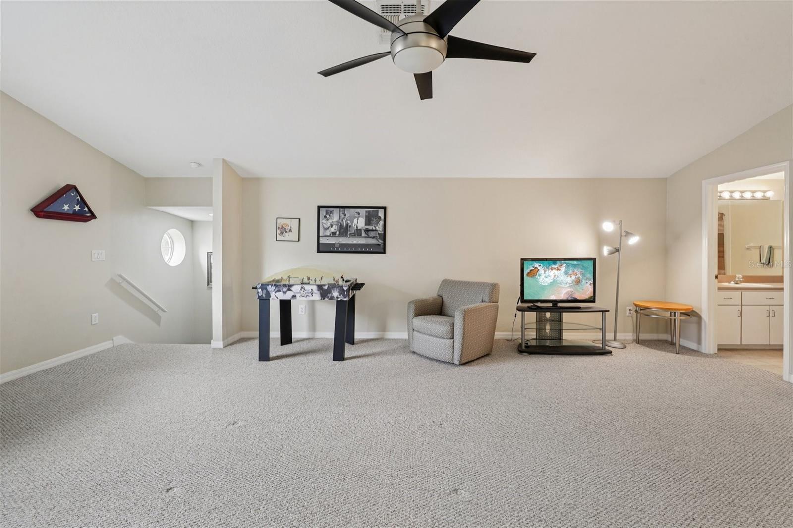 Giant Bonus room with separate bedroom and full bathroom.