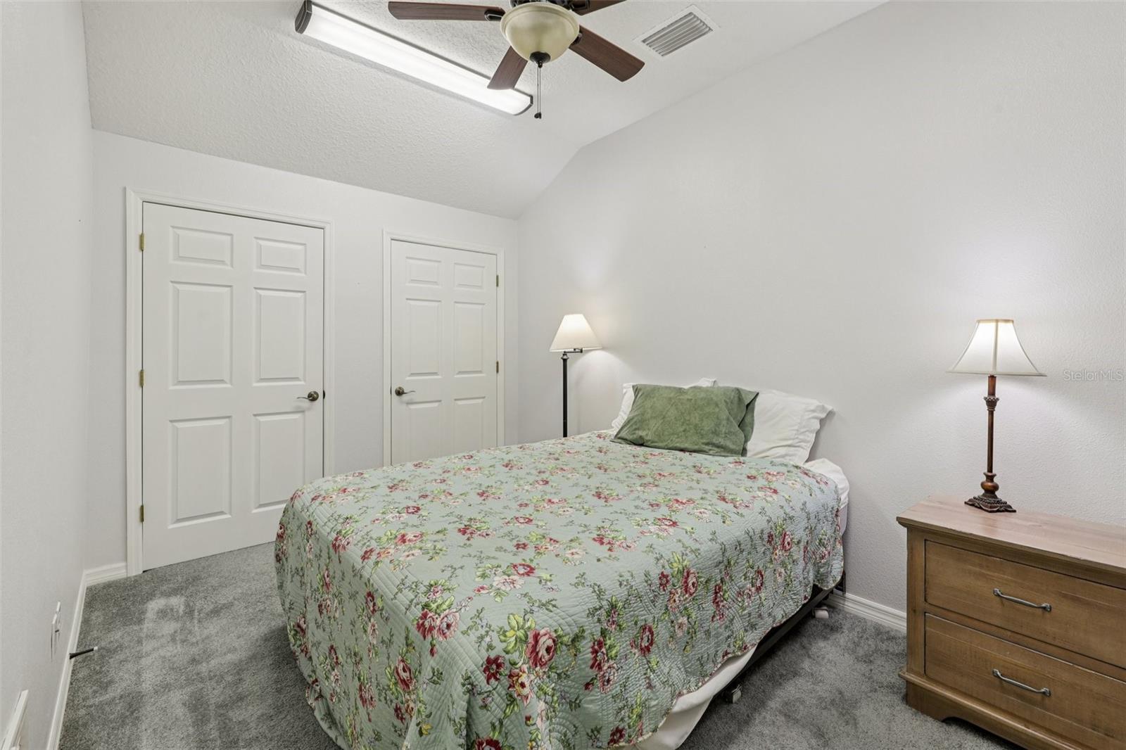 Separate Bedroom 5 off the bonus room with giant closets