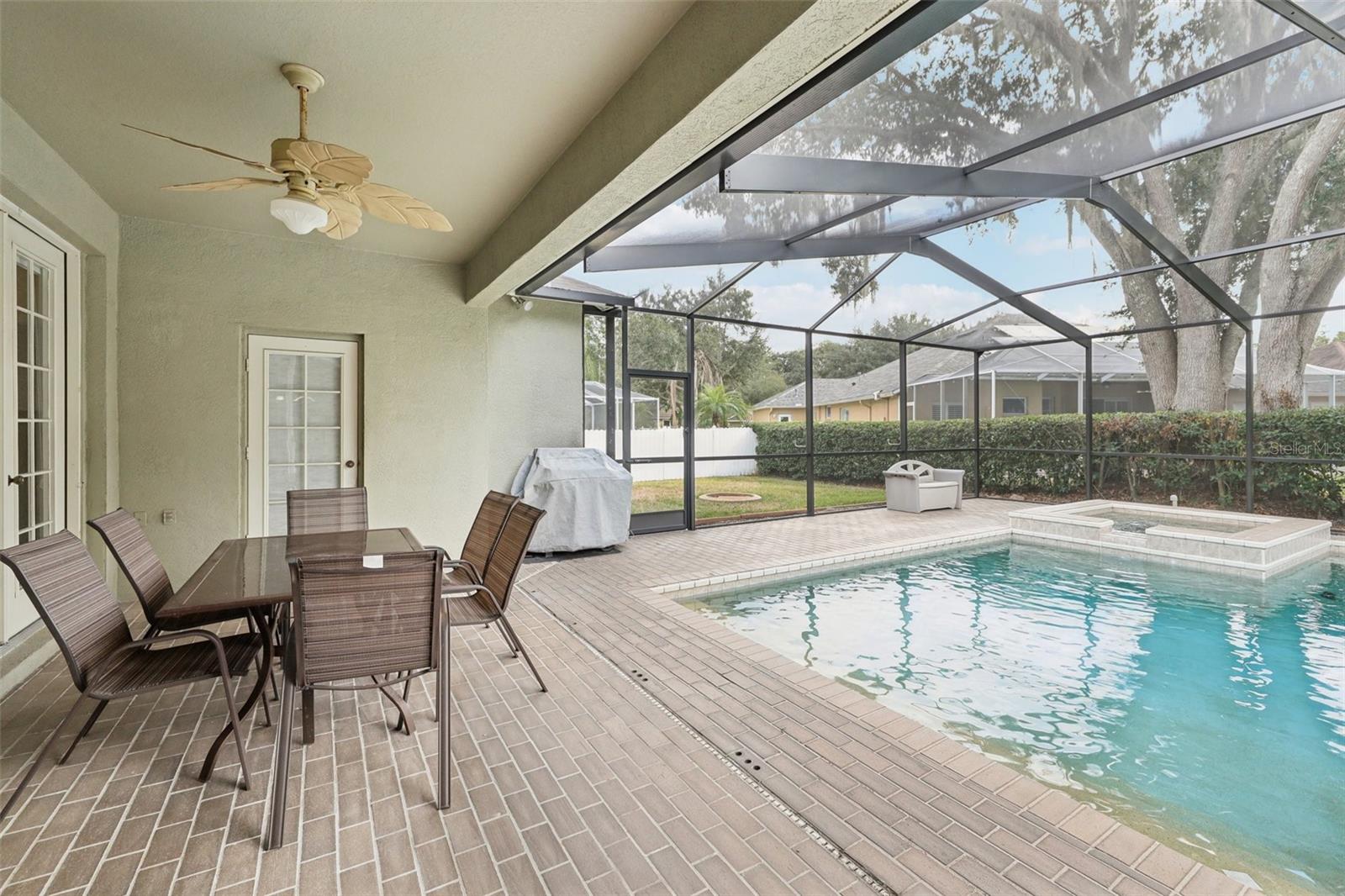 Lanai with child protective fence, heated spa and pool