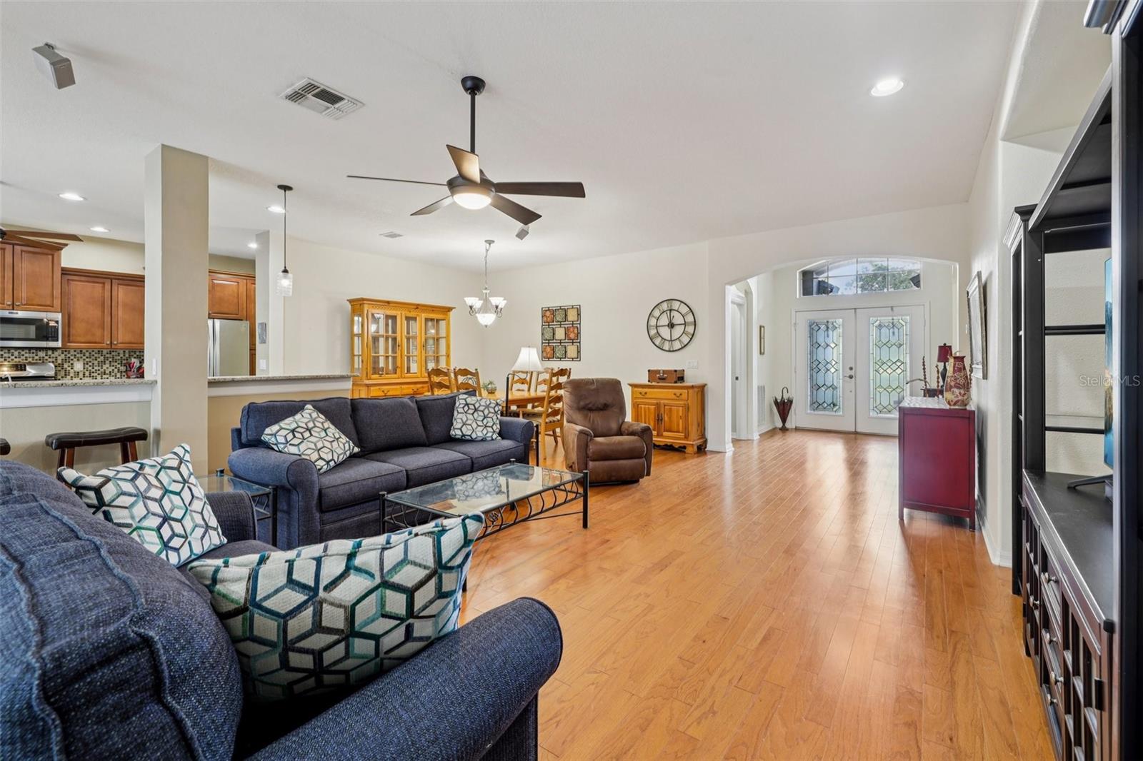 Living Room with view to outside Lanai, Kitchen and Dining Areas