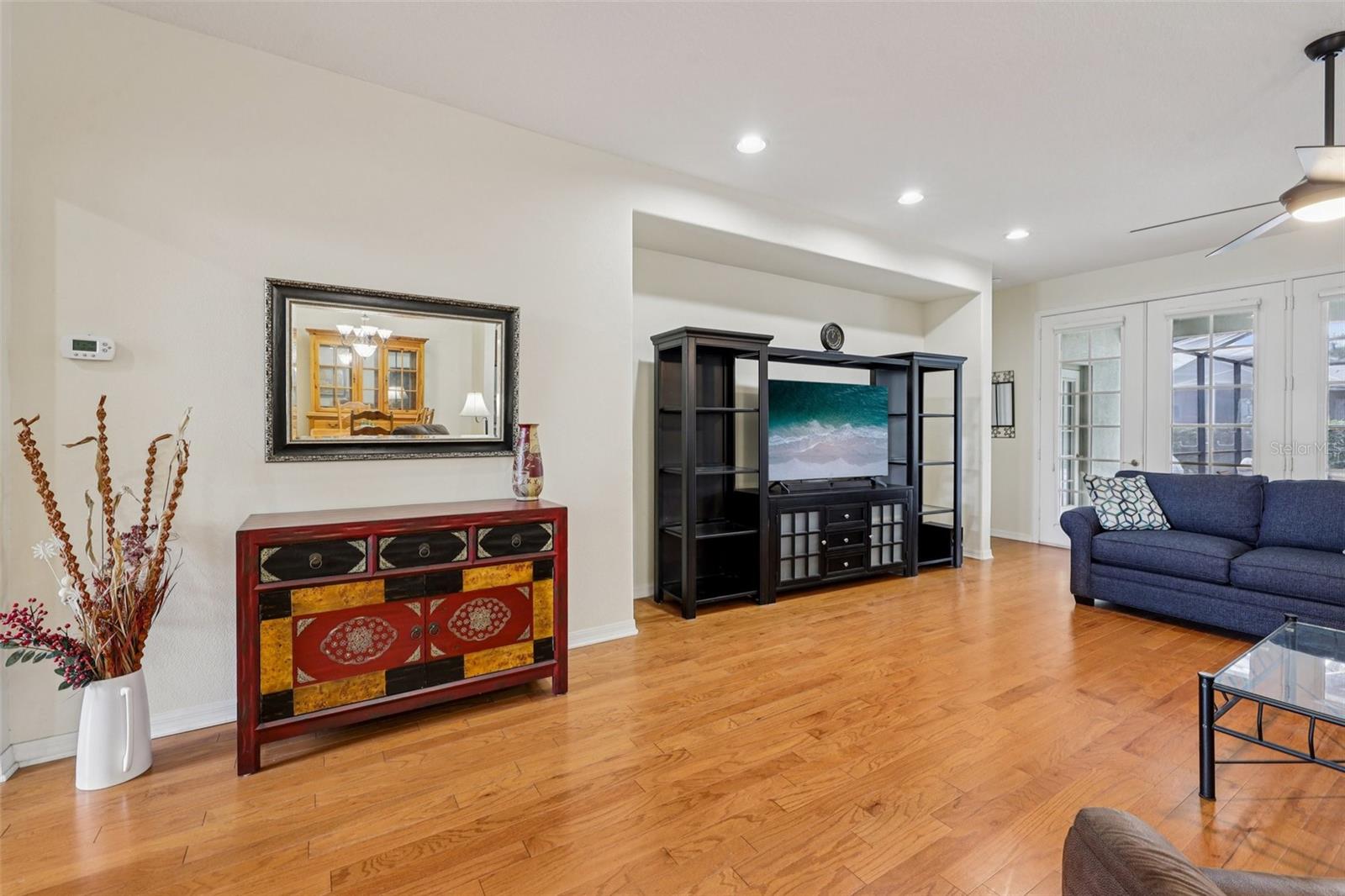 Living Room with view to outside Lanai, Kitchen and Dining Areas