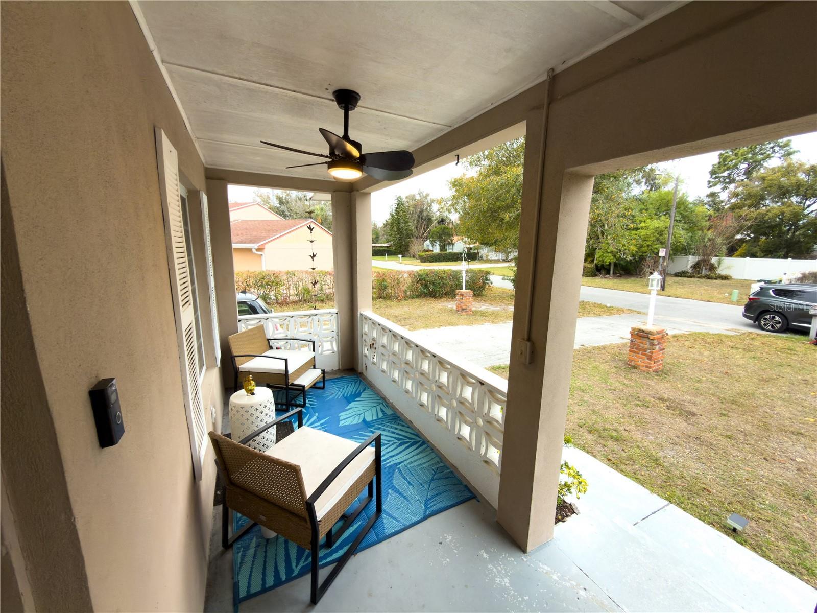 Super cute front porch with fan