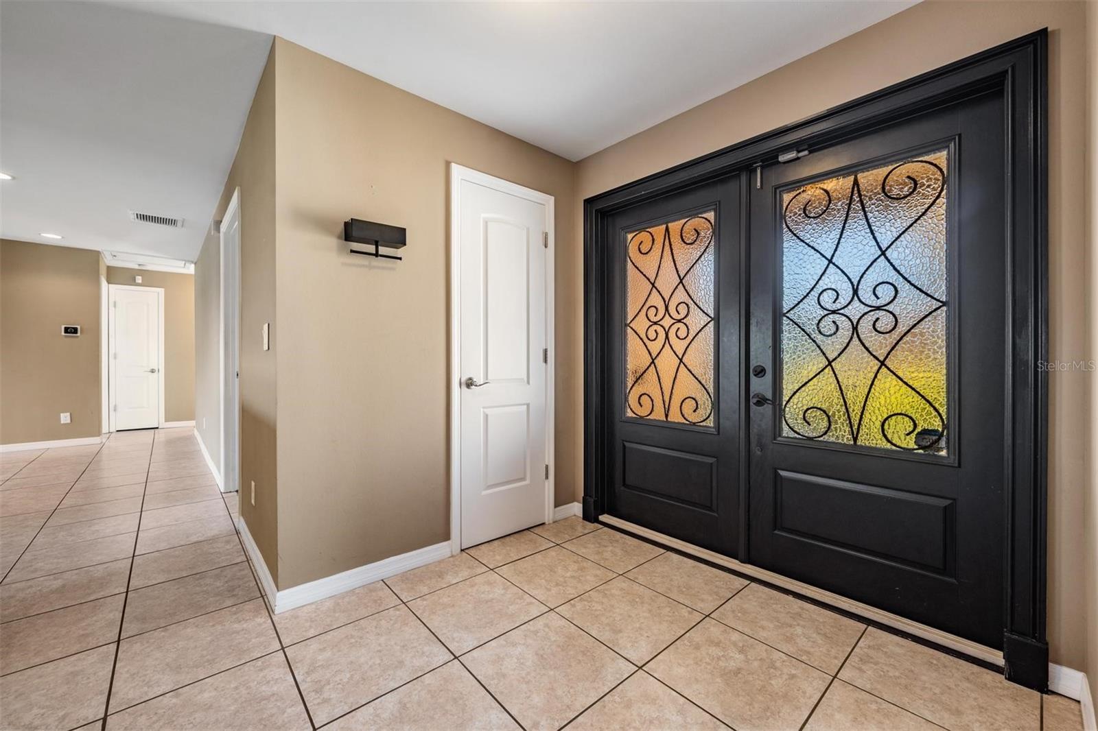 Front door and door to half bath