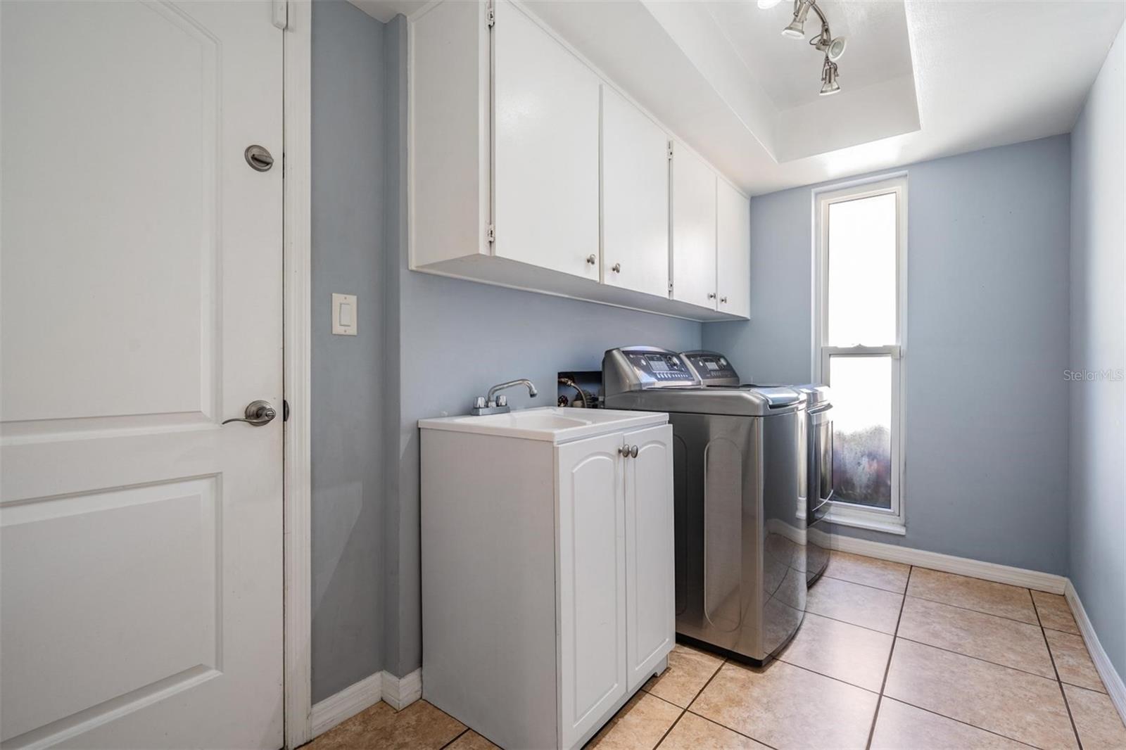 Laundry room with door to garage