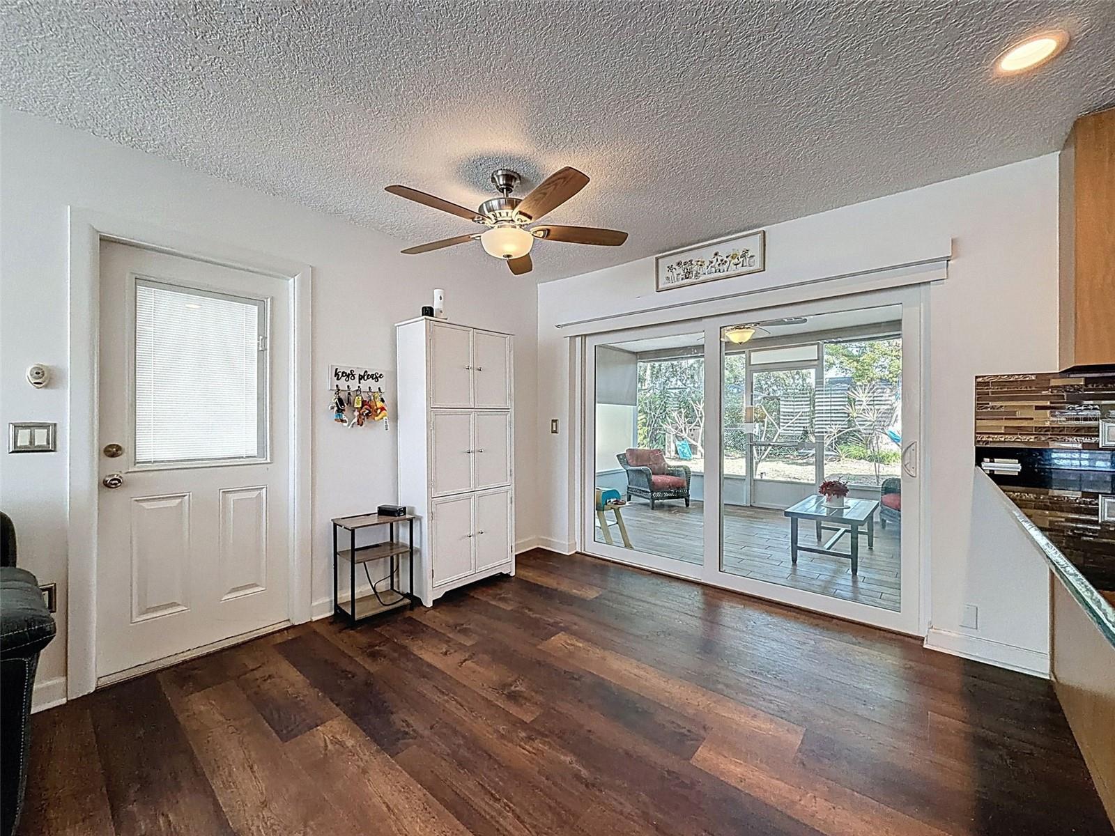 Sliders from the Family Room lead out to the large screened porch