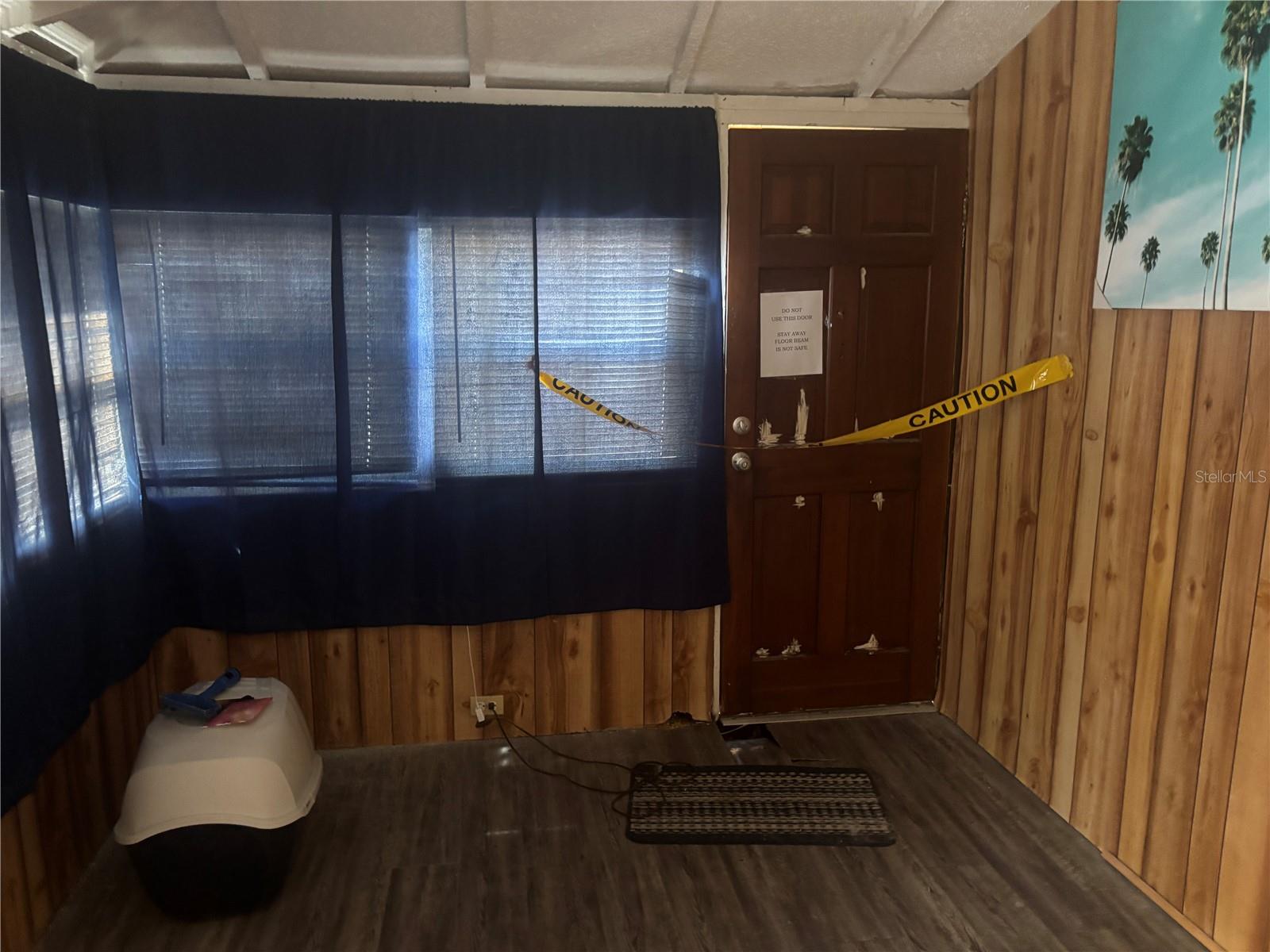 notice caution tape at front door