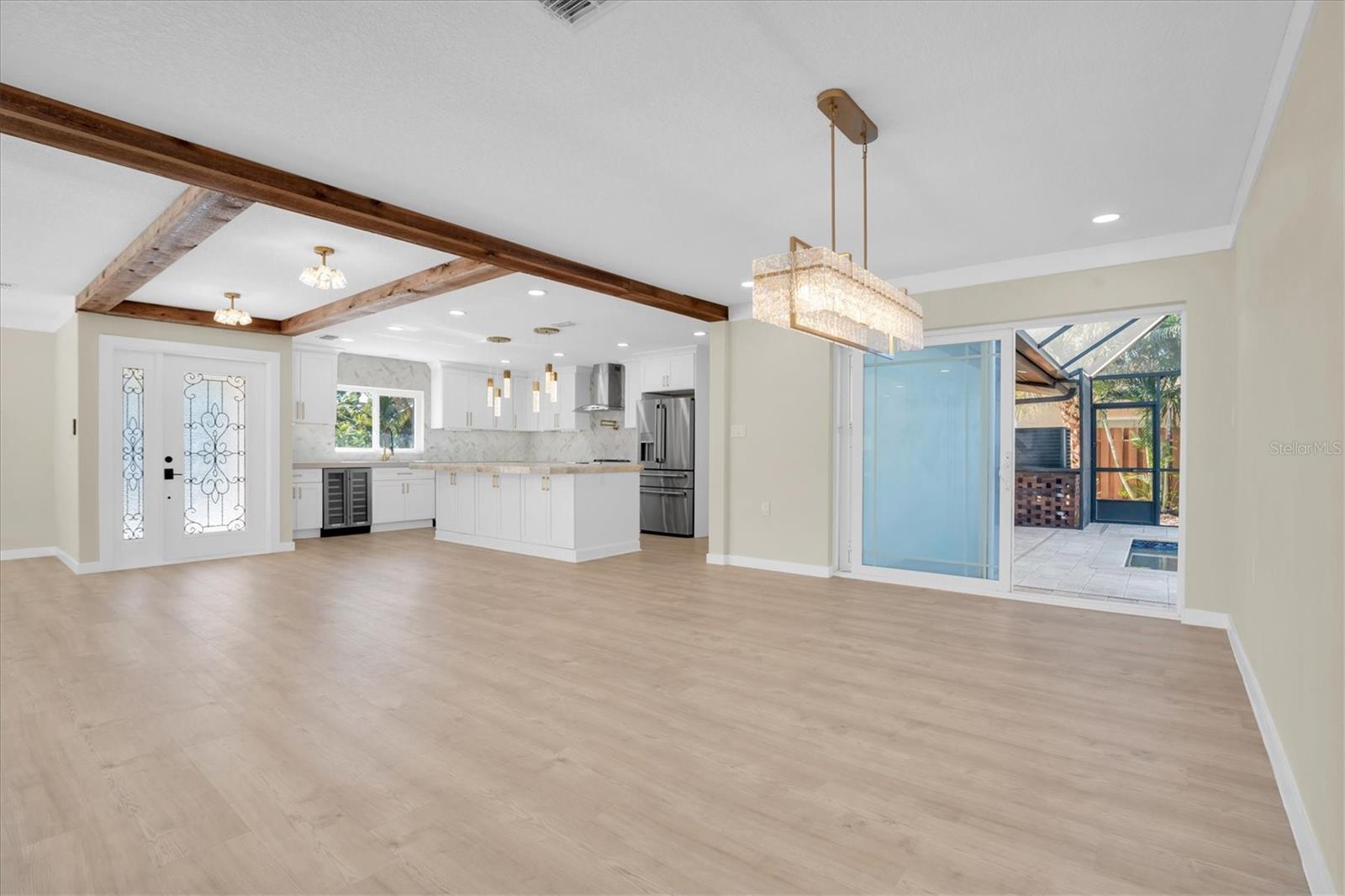 Perfectly positioned near the designer kitchen, the dining room makes hosting both elegant and effortless.