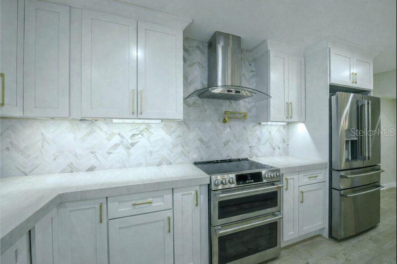 A convenient articulating pot filler & sleek designer range hood elevate the kitchen’s modern luxury.