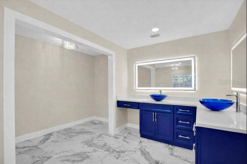 The closet is generously sized, with updated doors currently being installed to complete the refined look.