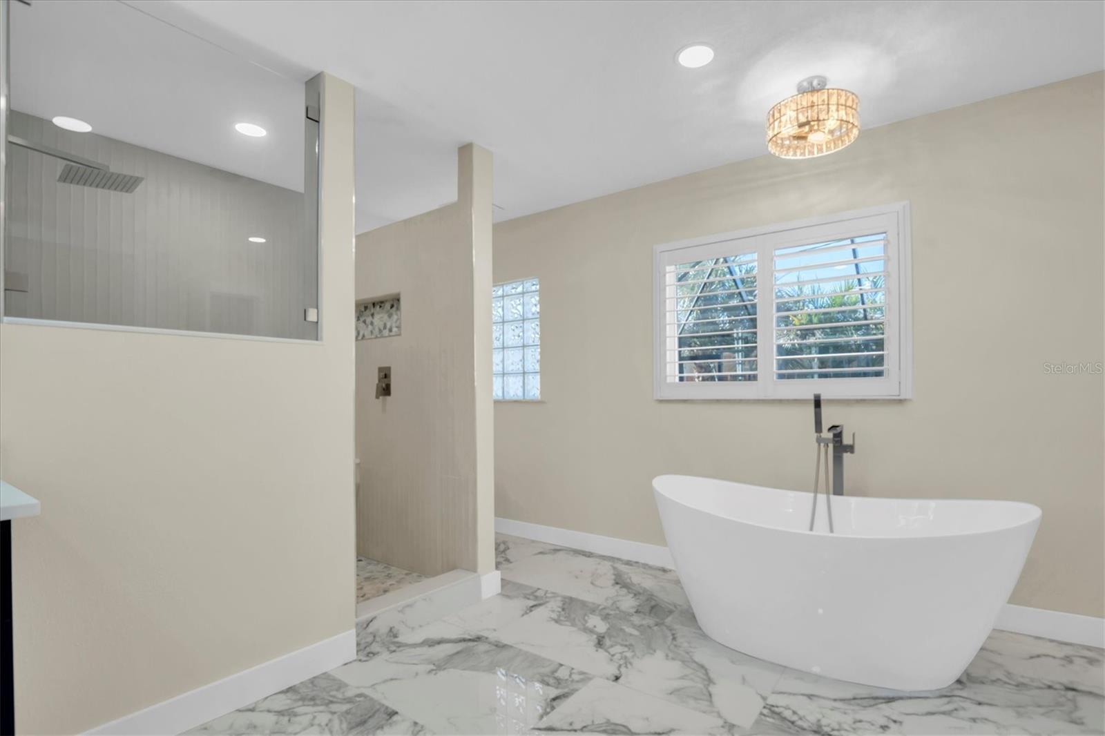 Allow yourself to indulge in the elegant soaking tub, designed for ultimate relaxation.
