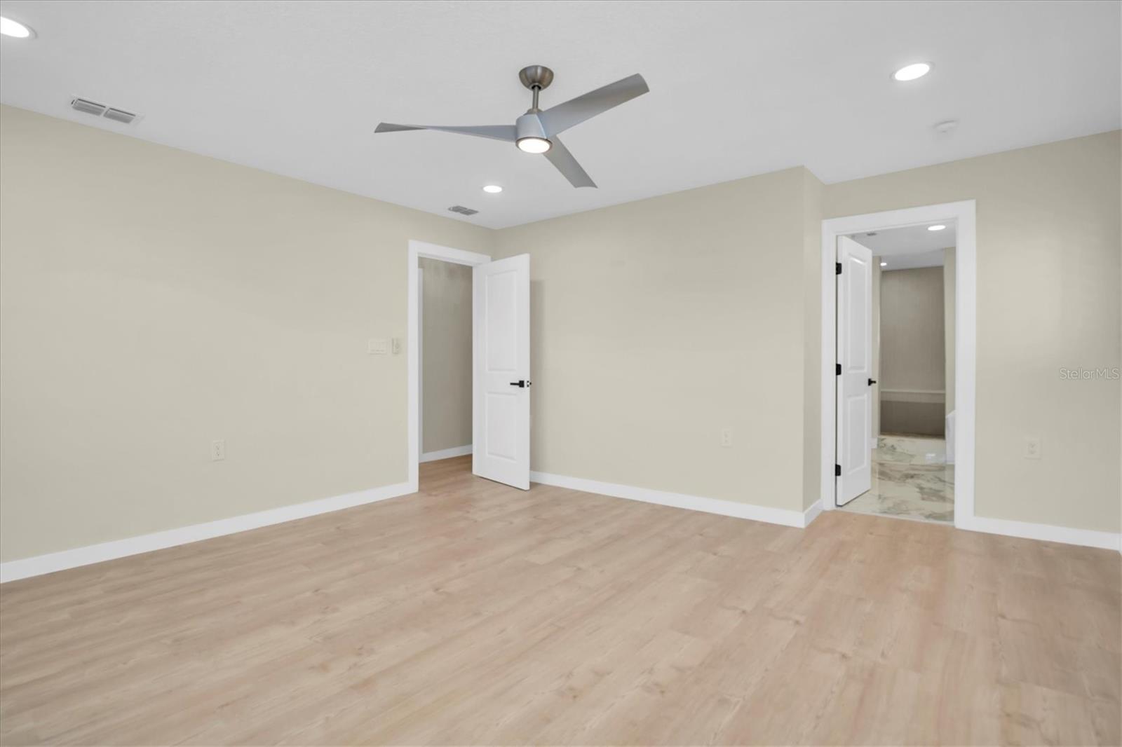 Nestled at the back of the home, the primary bedroom provides a serene and private retreat.