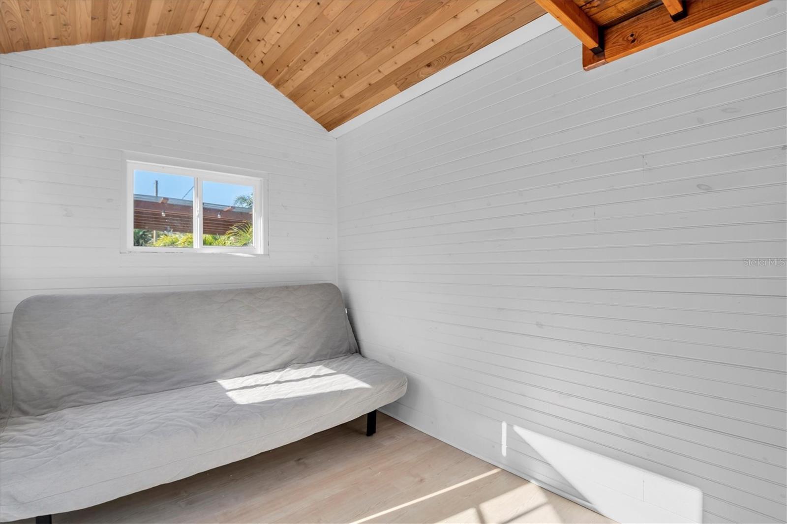 The shed’s interior is attractively finished, offering a clean & well-kept space.