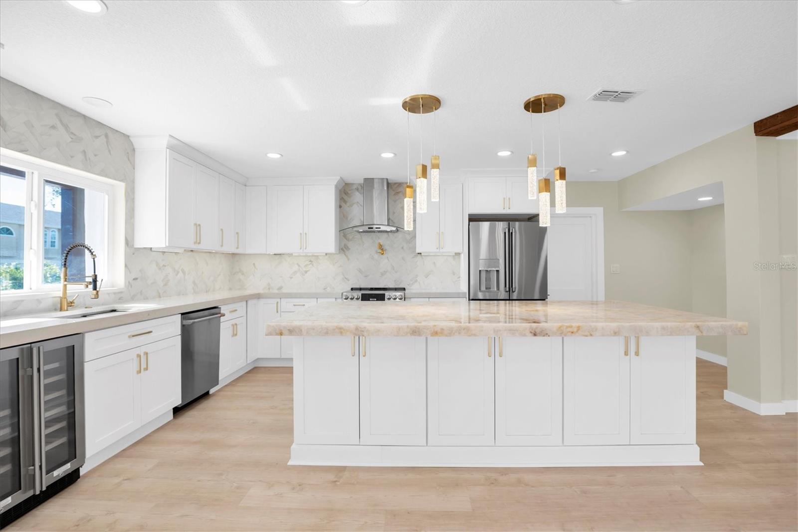 A beautifully curated, designer kitchen with an ideal layout fit for the chef who demands excellence.