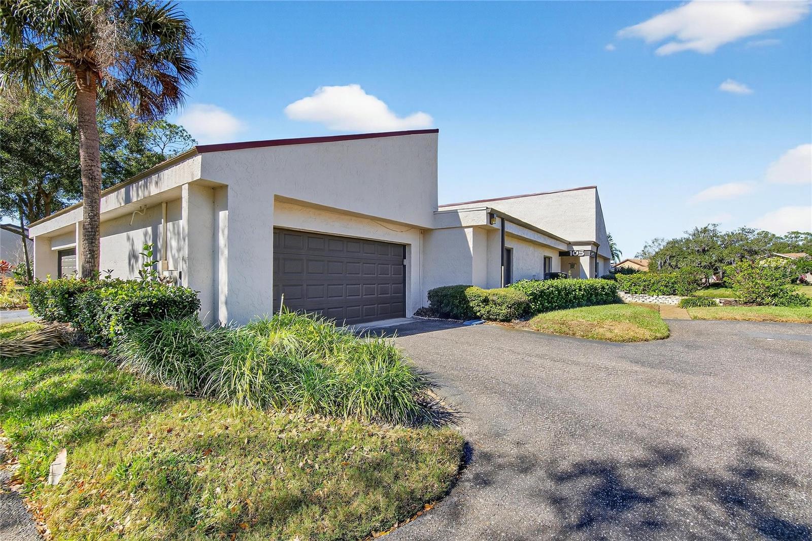 Garage with front door to the right.