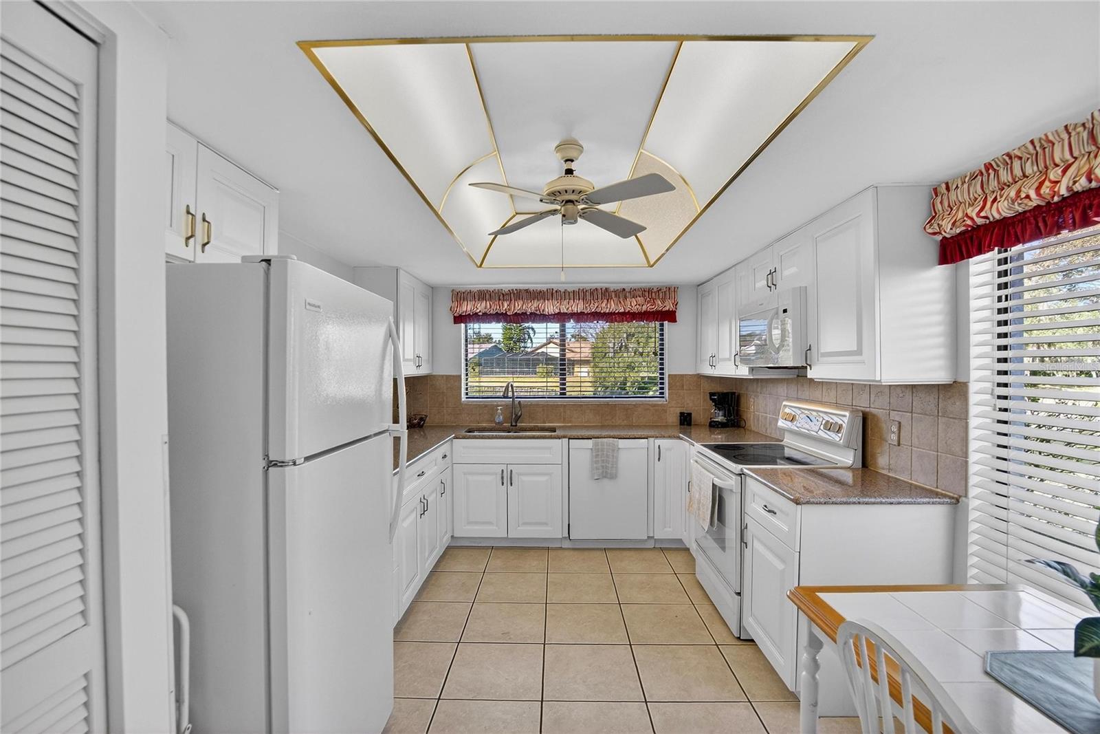 Kitchen with view to pond. Eating space in kitchen. Kitchen cabinets have soft close doors and drawers.