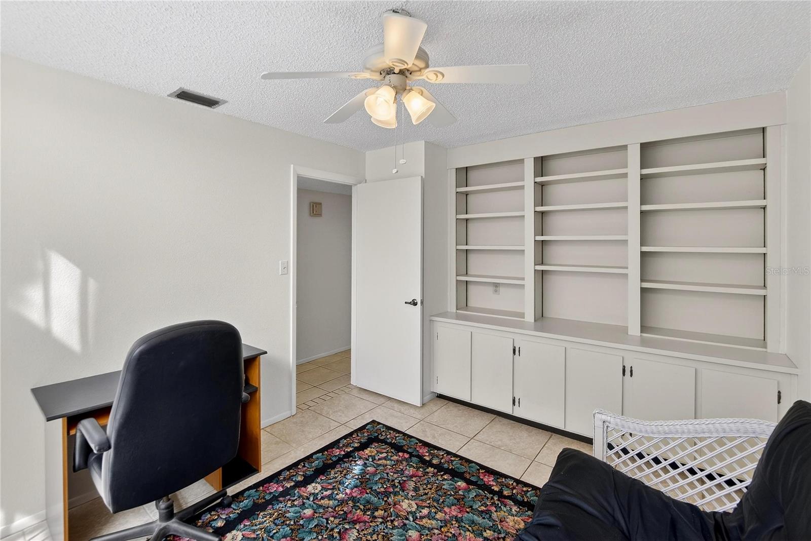 3rd bedroom/office. Built in shelves in closet