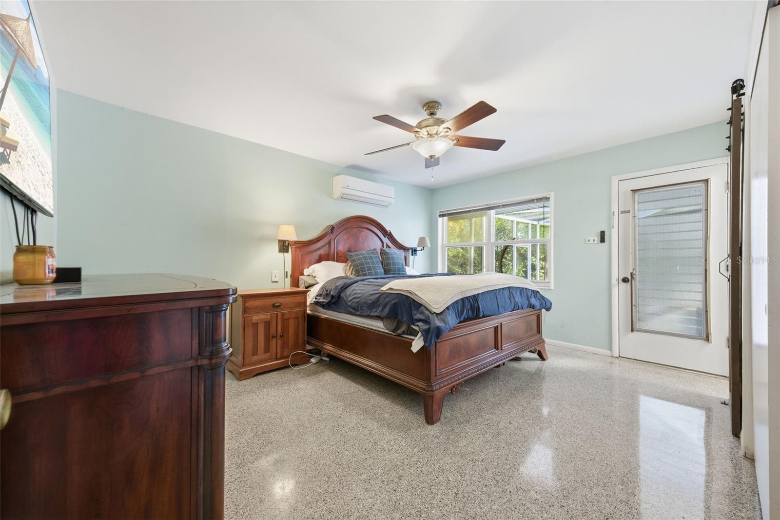 Primary Bedroom with door to pool deck