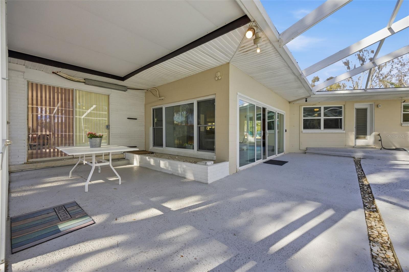 Dining area of pool lanai from door to back yard