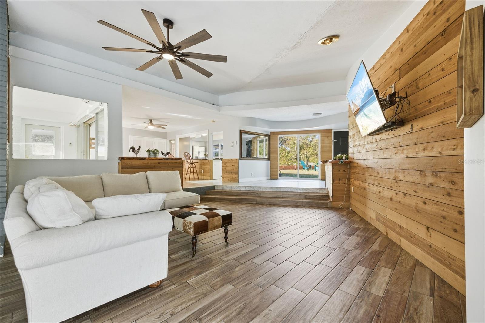 Large Family room with sliding door and panoramic window