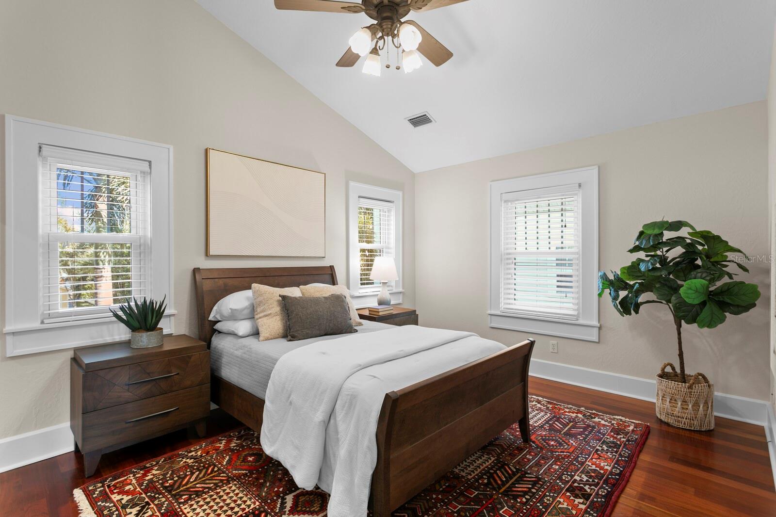 Second upstairs suite with vaulted ceiling, private bathroom and walk-in closet