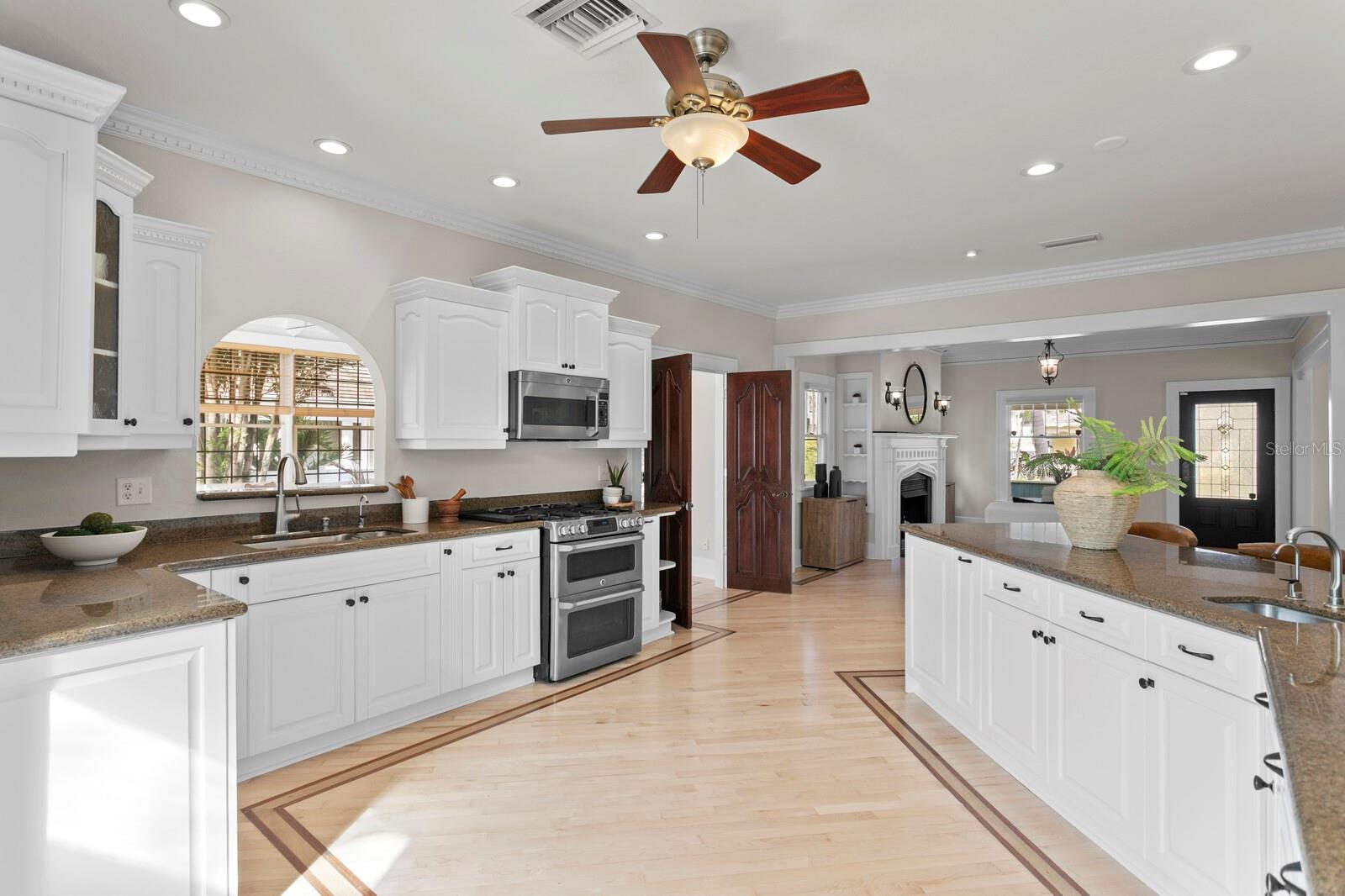 Large open kitchen connecting to back porch