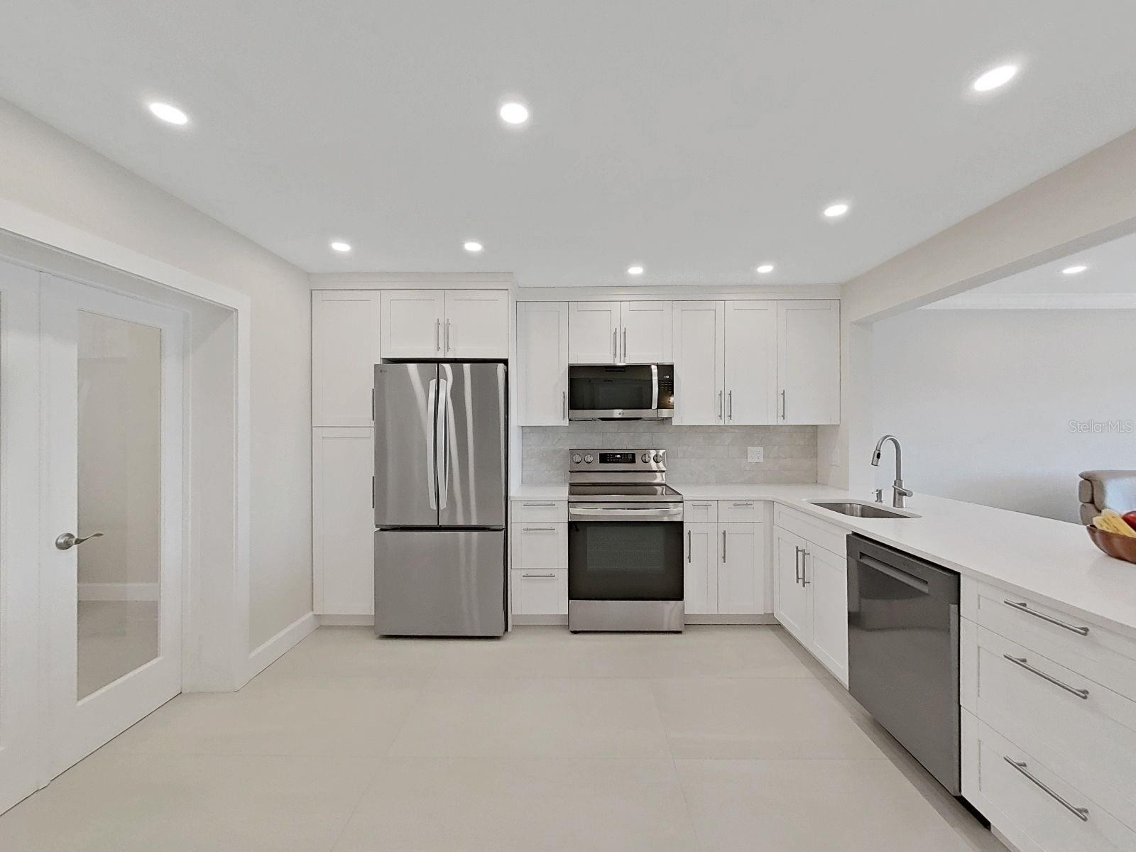 The home features led recessed lighting throughout, crown molding, 5 1/4 inch baseboards and modern door trim.