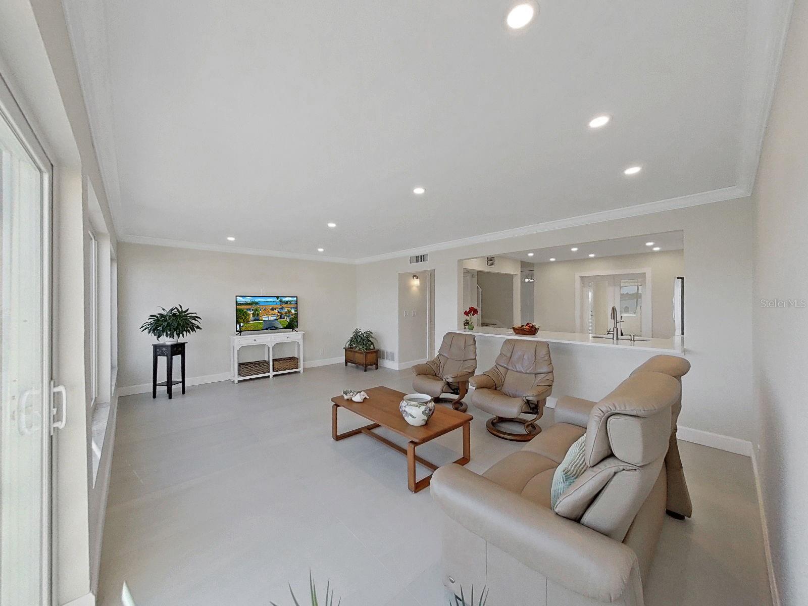 There is absolutely no carpet with porcelain 24x48 sleek tile flooring