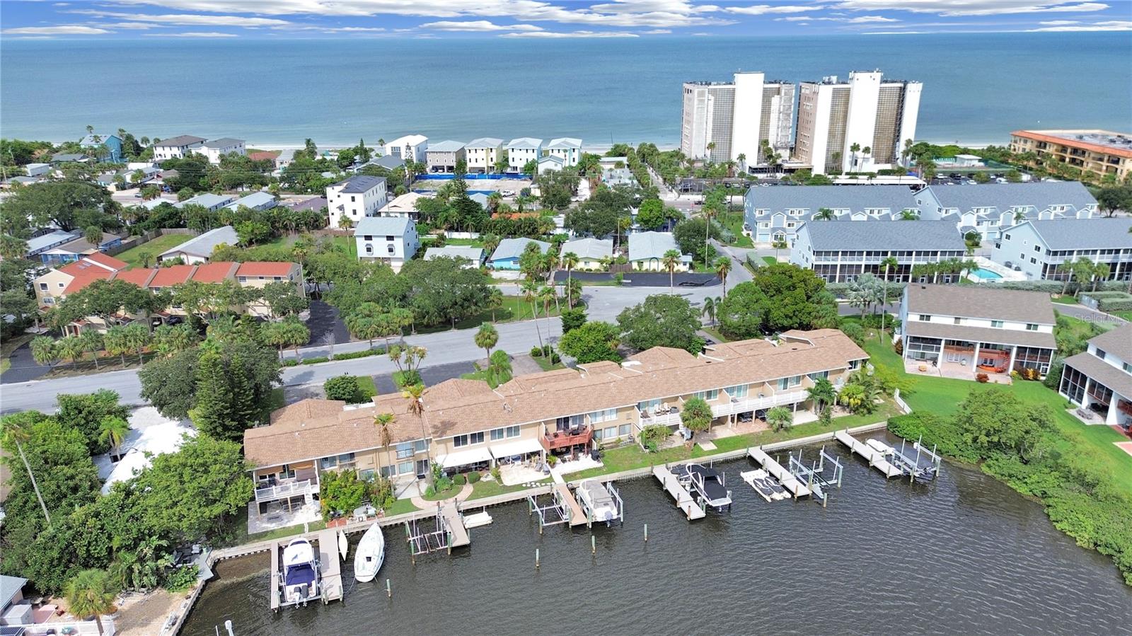 Enjoy both the beach & boat life. Short distance to the beach with a boat slip.