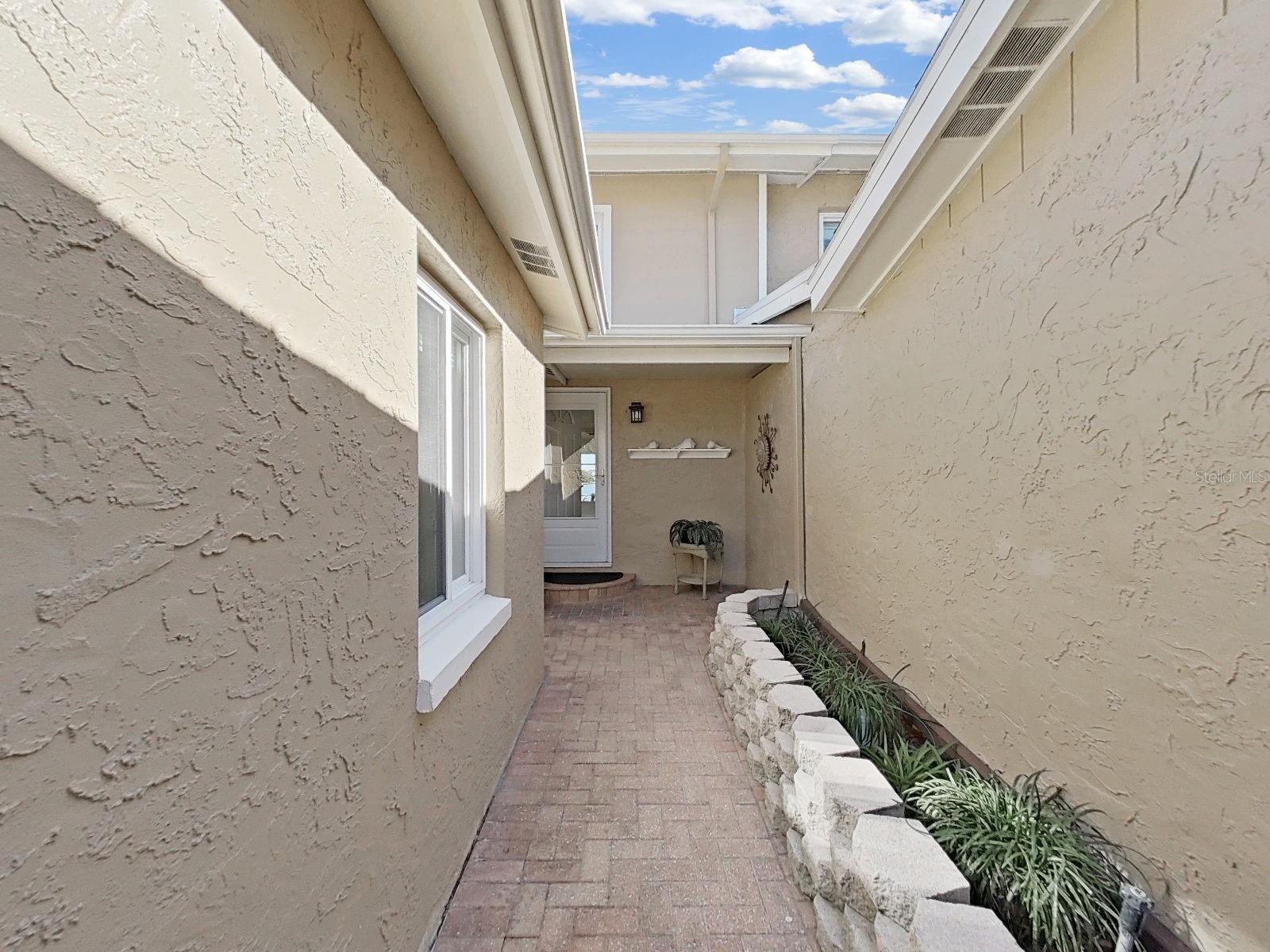 Brick paved courtyard.
