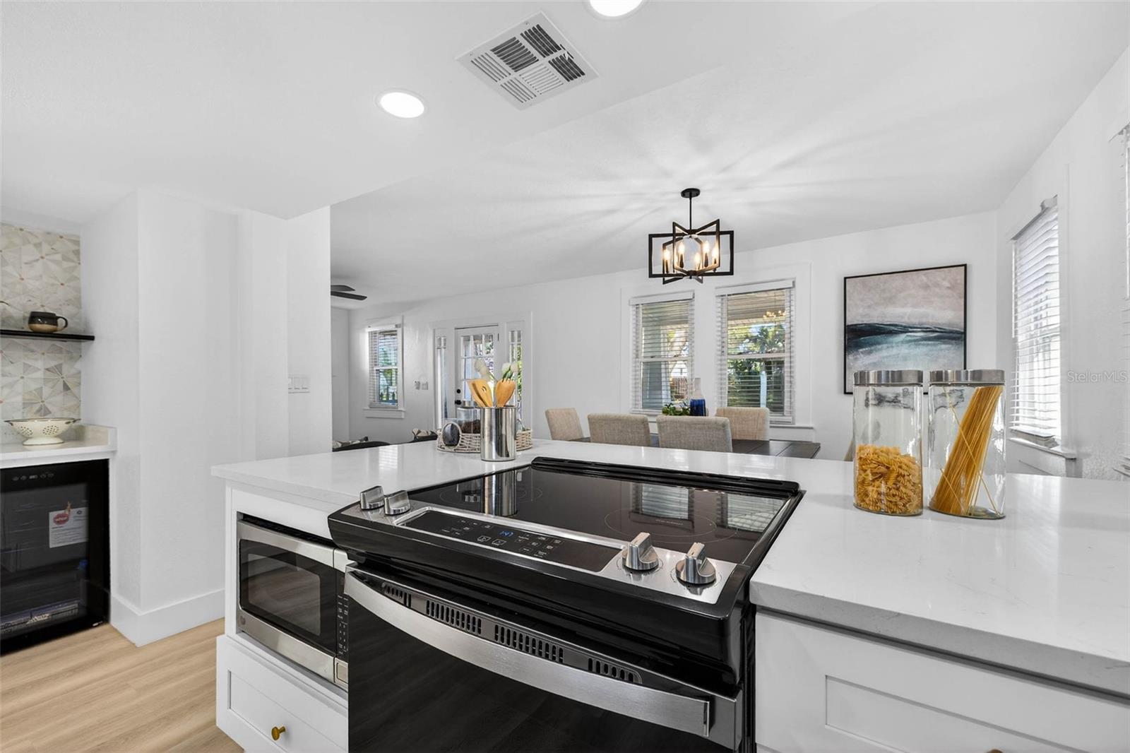 Built-in island stove with a sleek design, letting the chef engage with guests while preparing meals