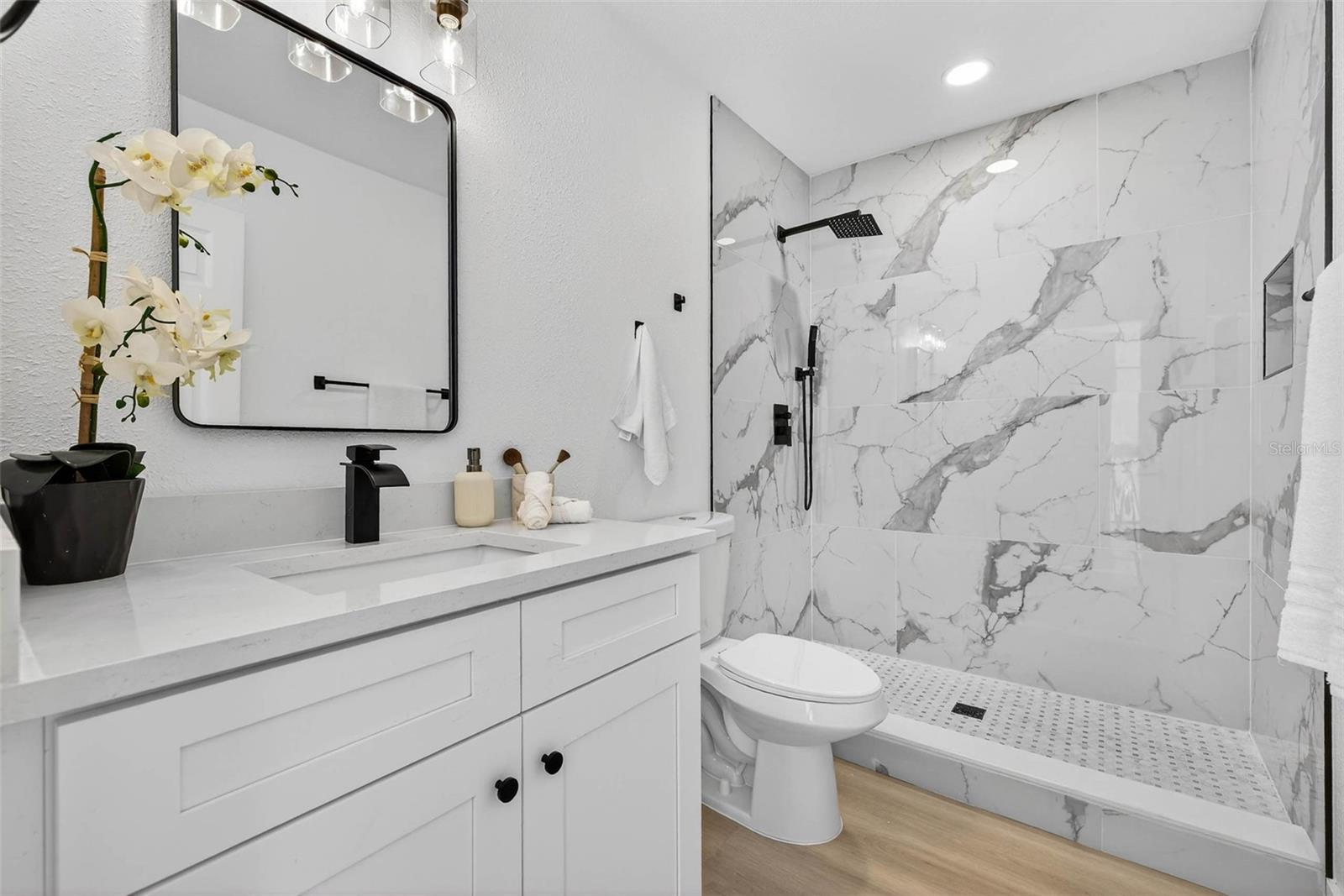 Primary Ensuite Bathroom with Custom Title Rainshower