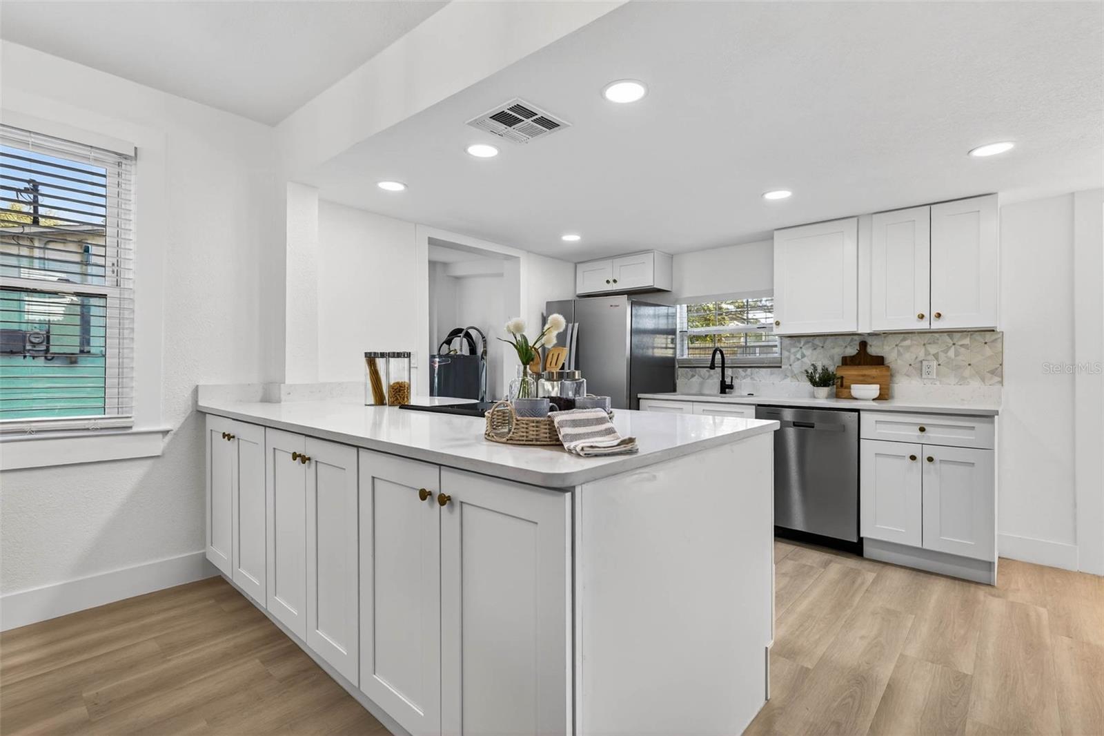 Kitchen with double sided cabinetry