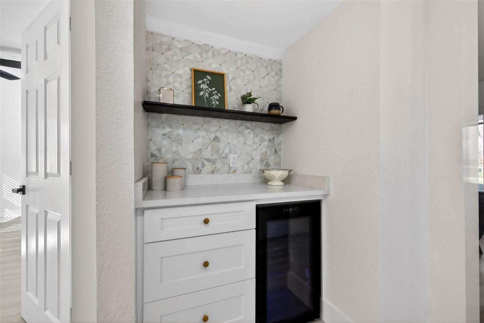Beverage nook with wine cooler and cabinetry
