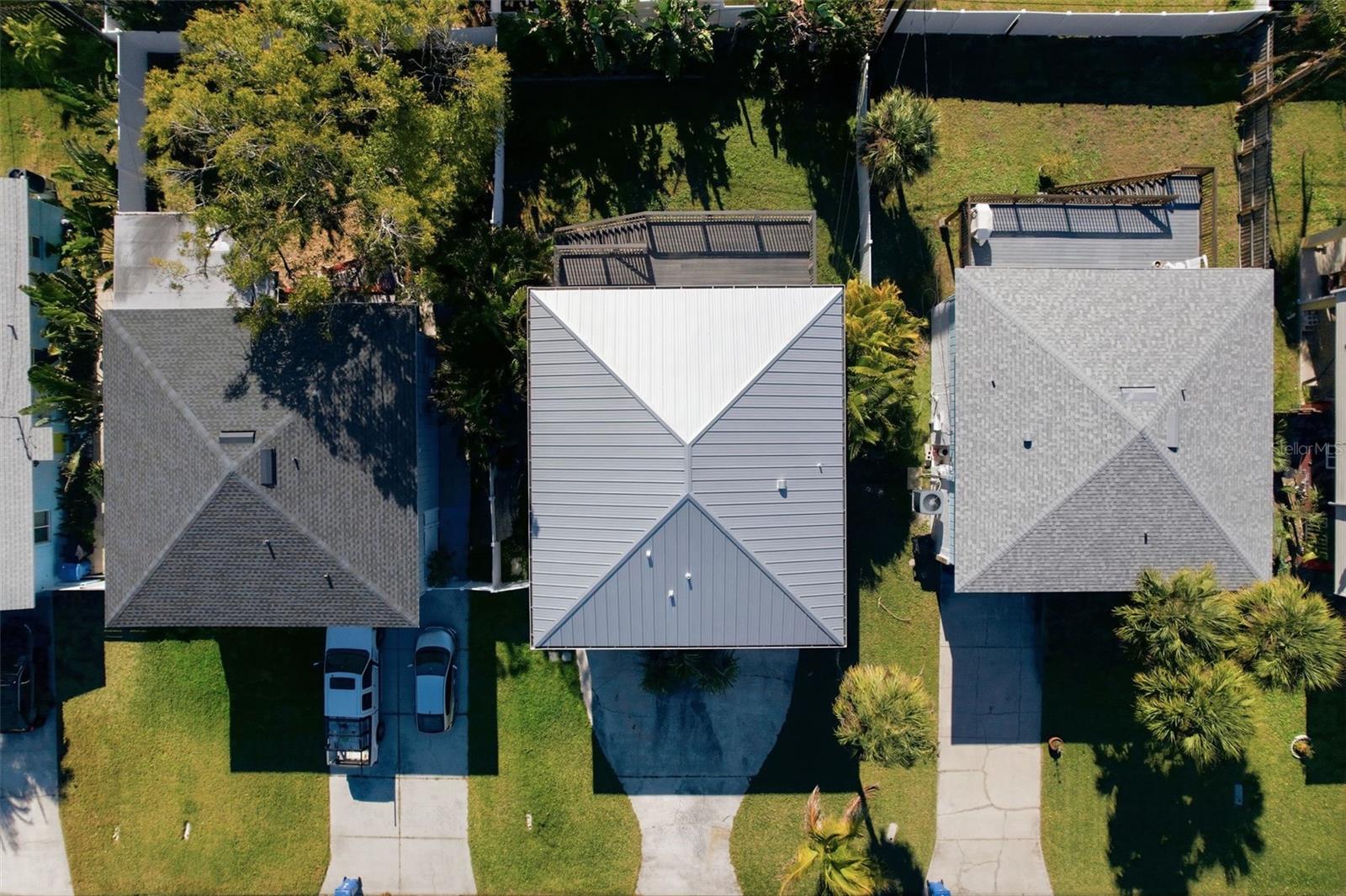 Metal roof for longevity and notice the large backyard!