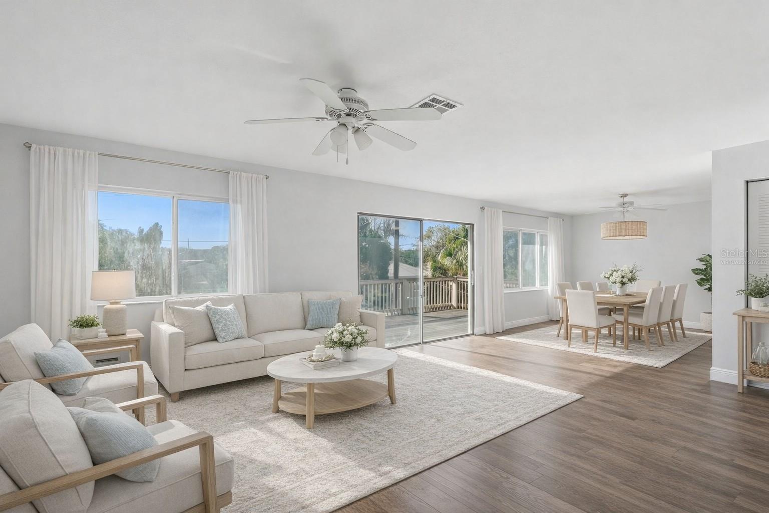 Virtually staged to show how spacious this great room is.