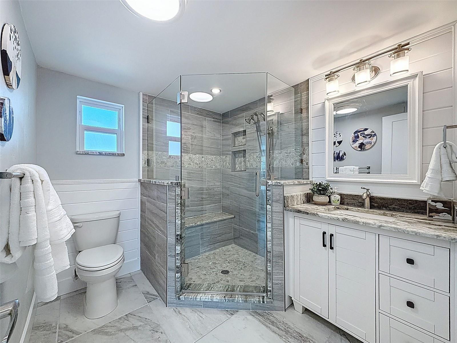 2 niches built in with a seat in the shower