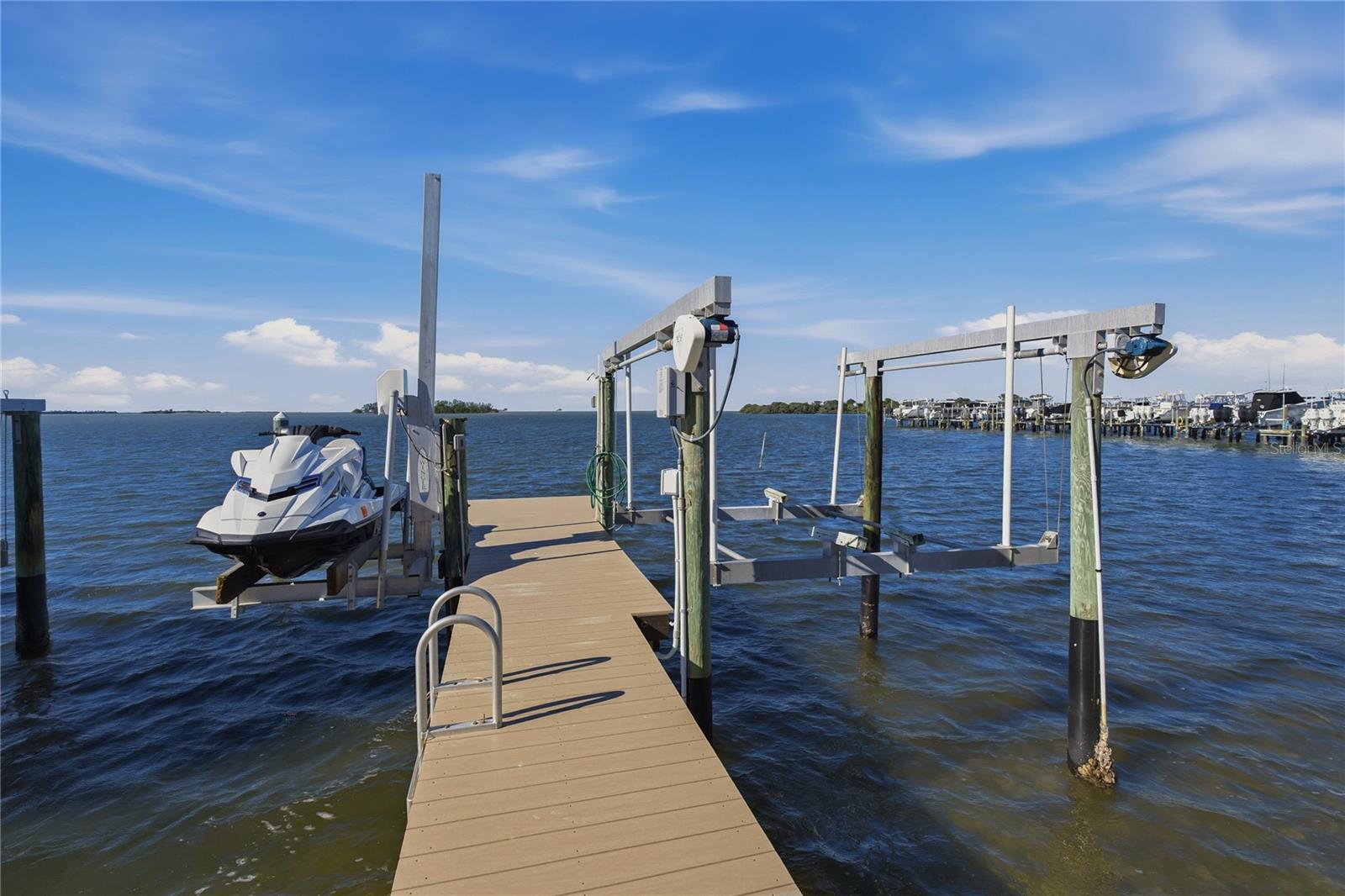 PRIVATE BOAT DOCK WITH 12,000 LB. BOAT LIFT & JETSKI LIFT