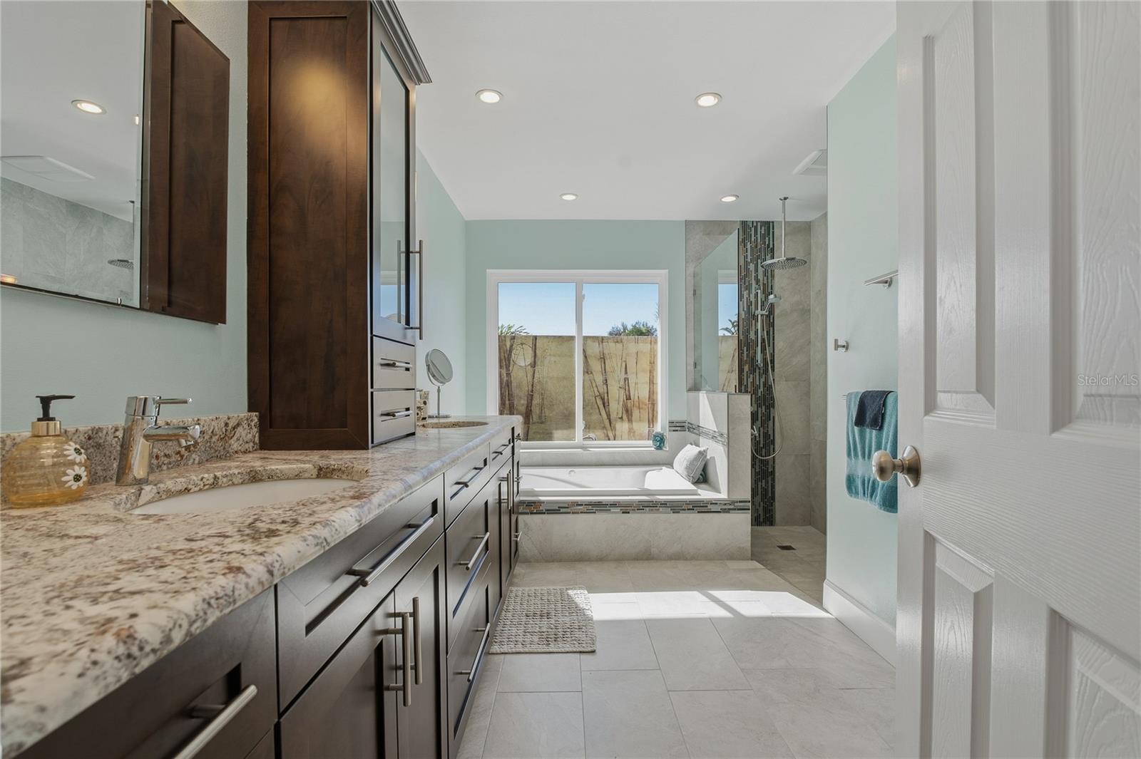 PRIMARY BATHROOM WITH WALK IN, RAINFALL SHOWER AND JACUZZI TUB!