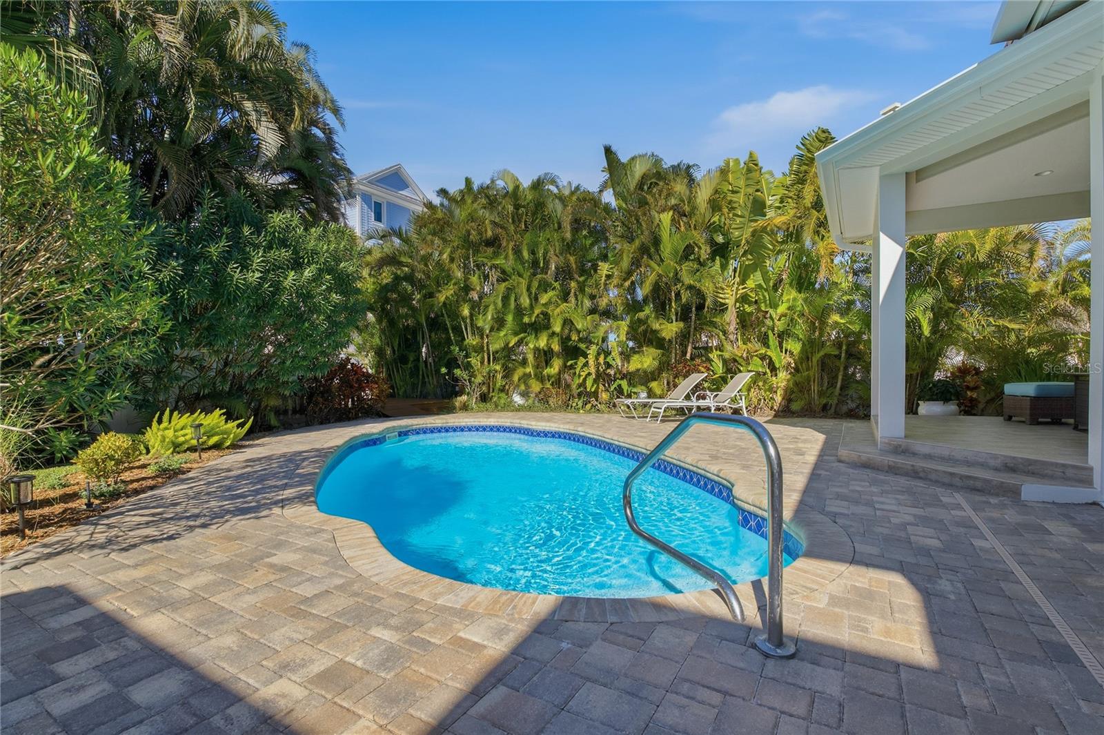 PRIVATE POOL SURROUNDED BY LUSH, MATURE LANDSCAPING!
