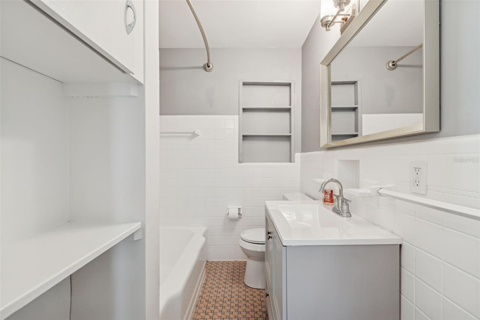 Guest bath with vintage floor tile