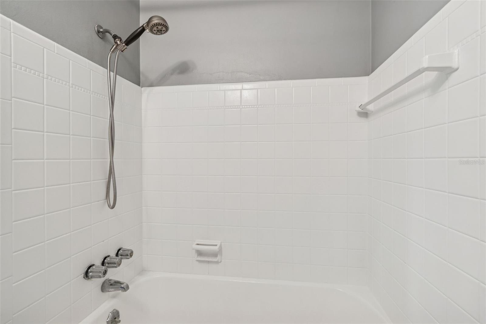 Guest bath has tub shower combo