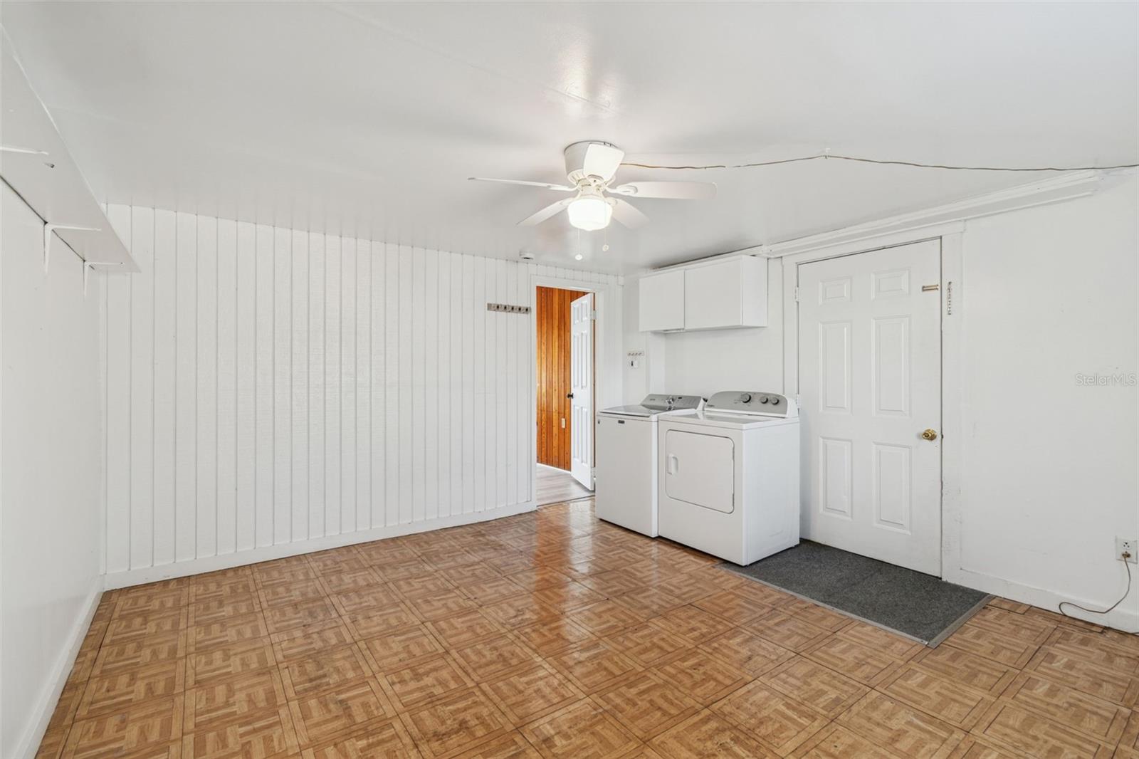 Laundry room has entrance to back yard