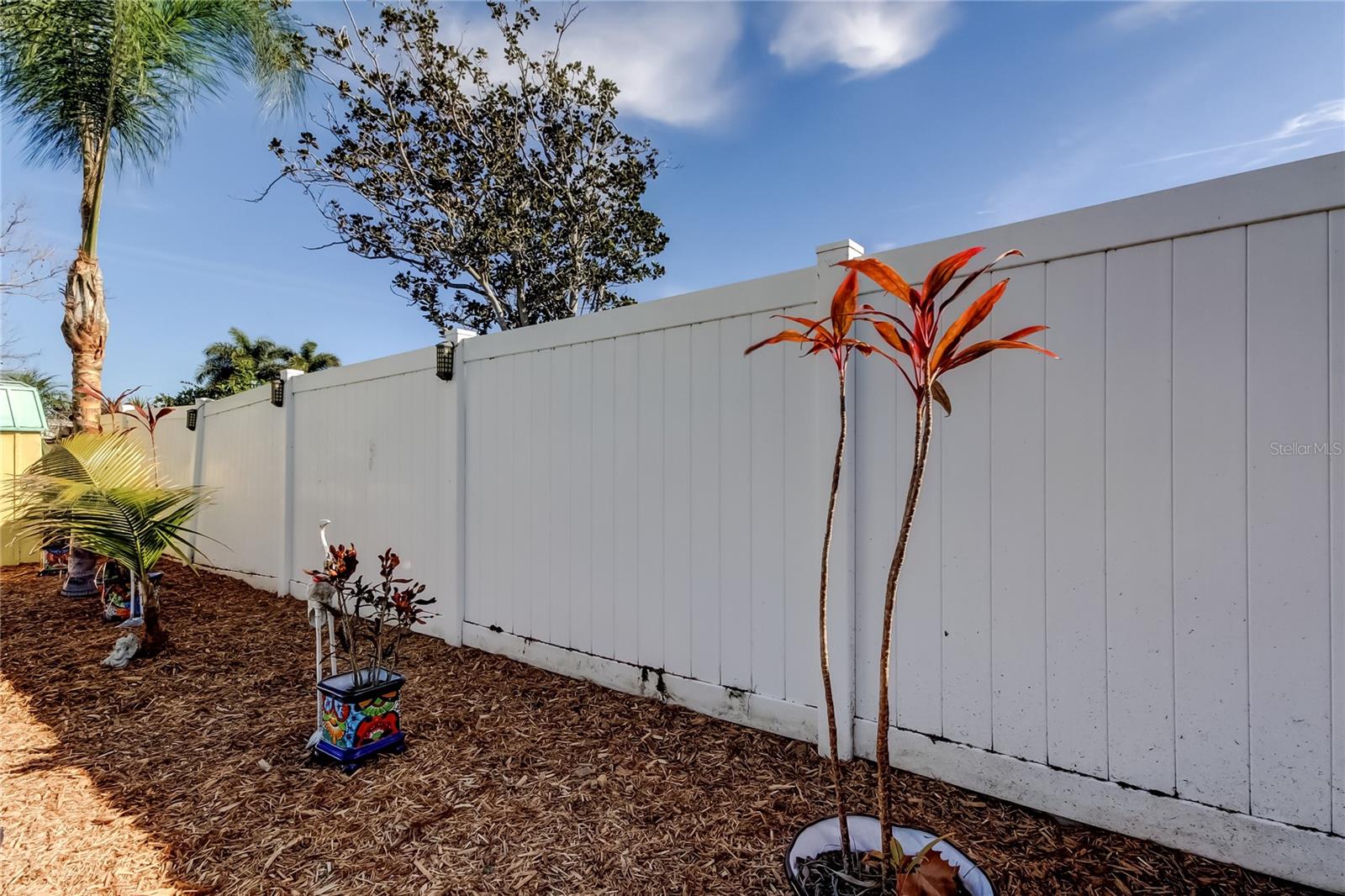 6 Foot Vinyl Privacy Fence - Enclosed Back Yard.