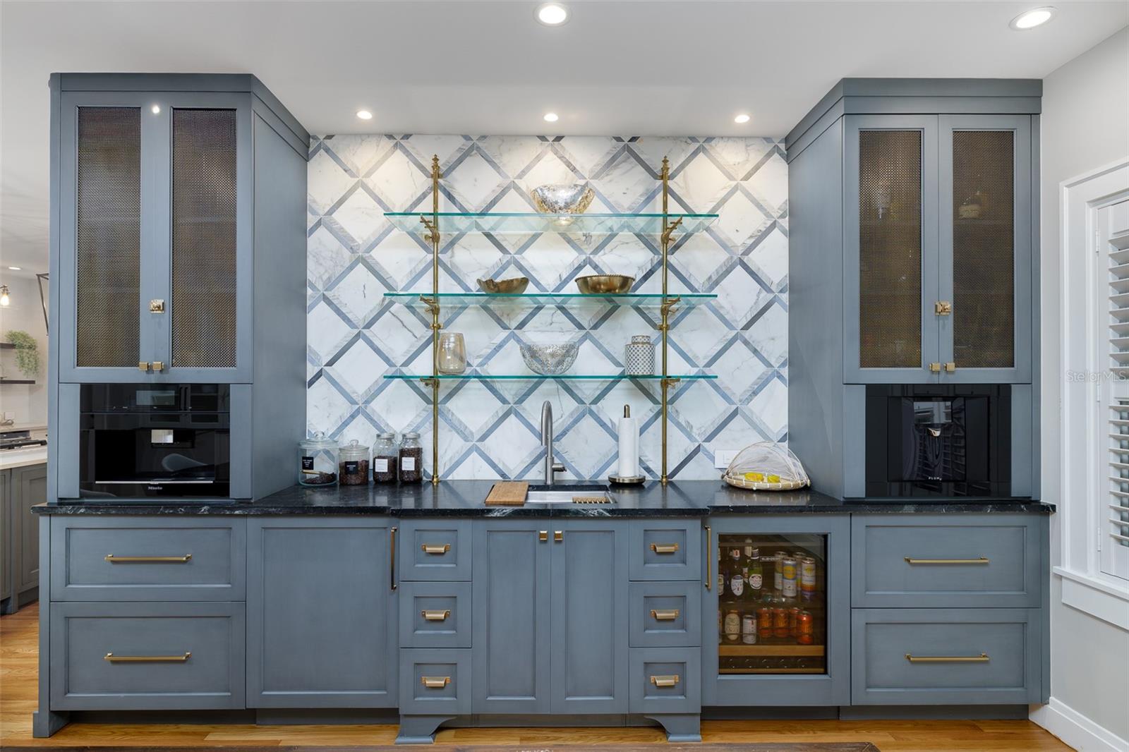 Miele Espresso/Coffee maker, Galley sink, Subzero fridge/freezer and Plum wine dispenser