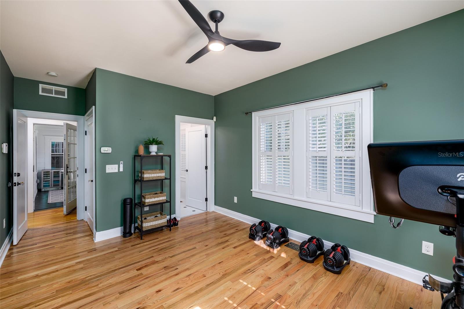 1st floor - bedroom #2 used as a home gym, en-suite bathroom with tub