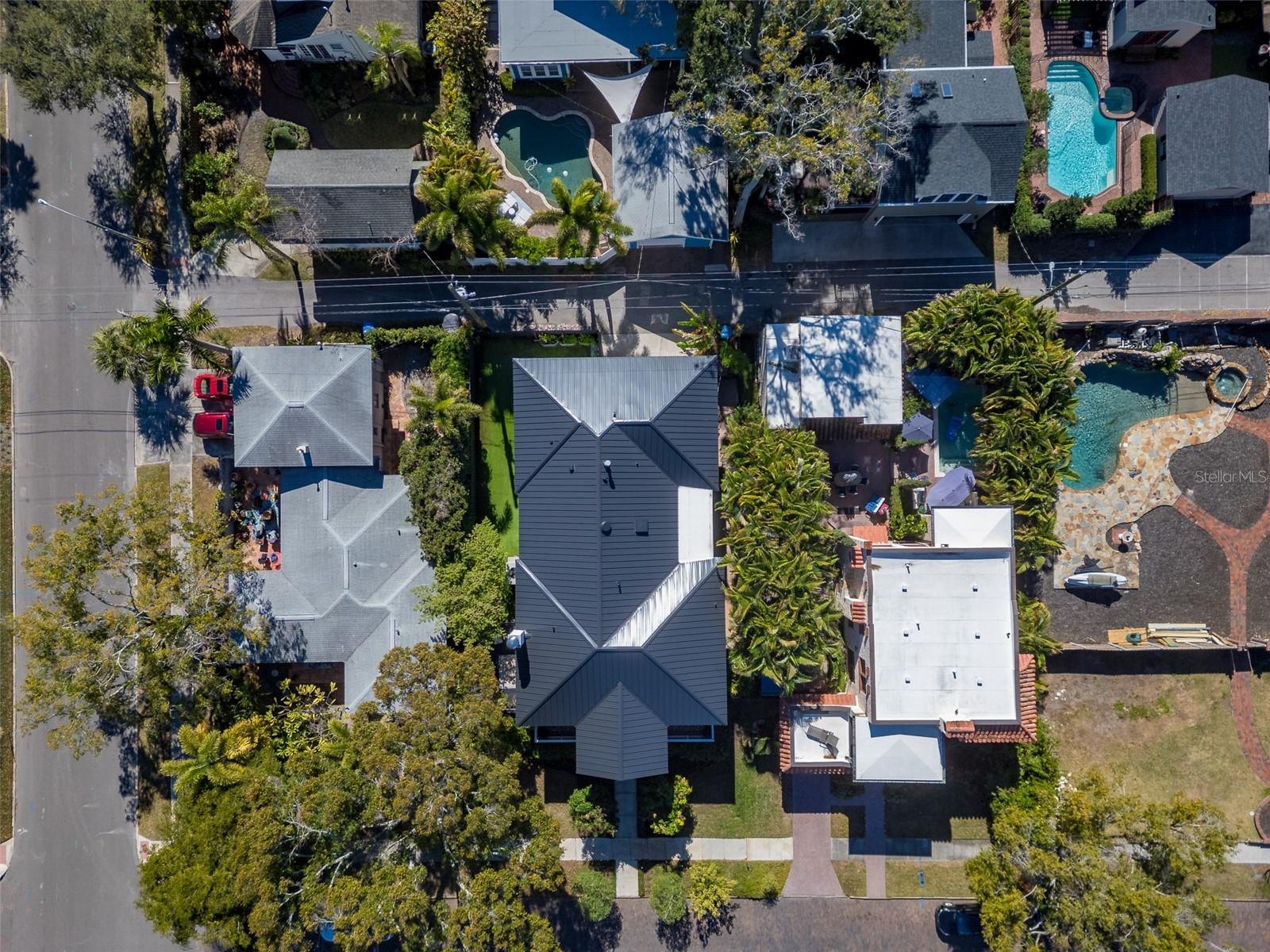 Aerial of home with metal roof, showing alley access and 16th Street South (brick)
