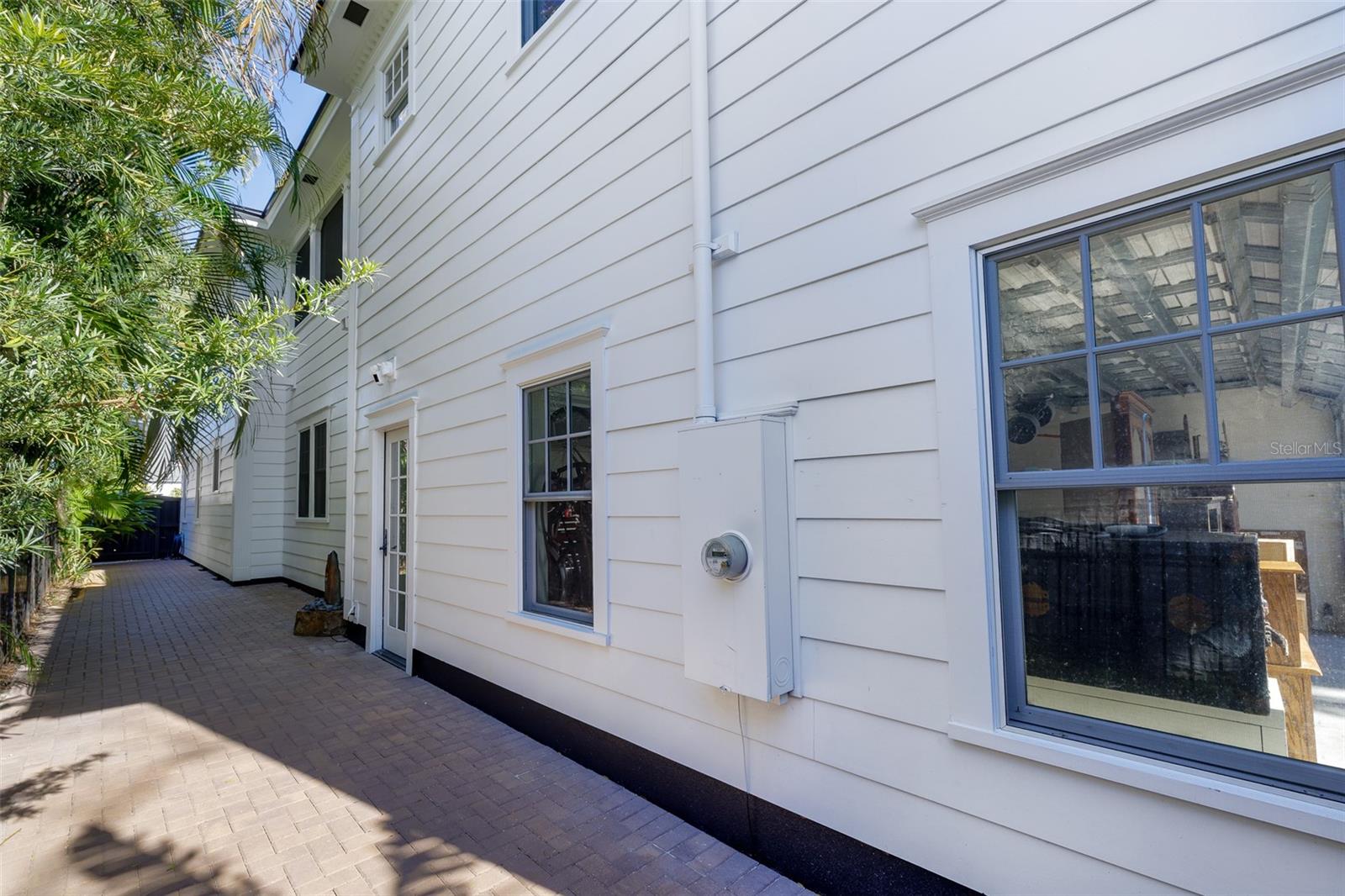 West Side of Property, paved with fountain and palms