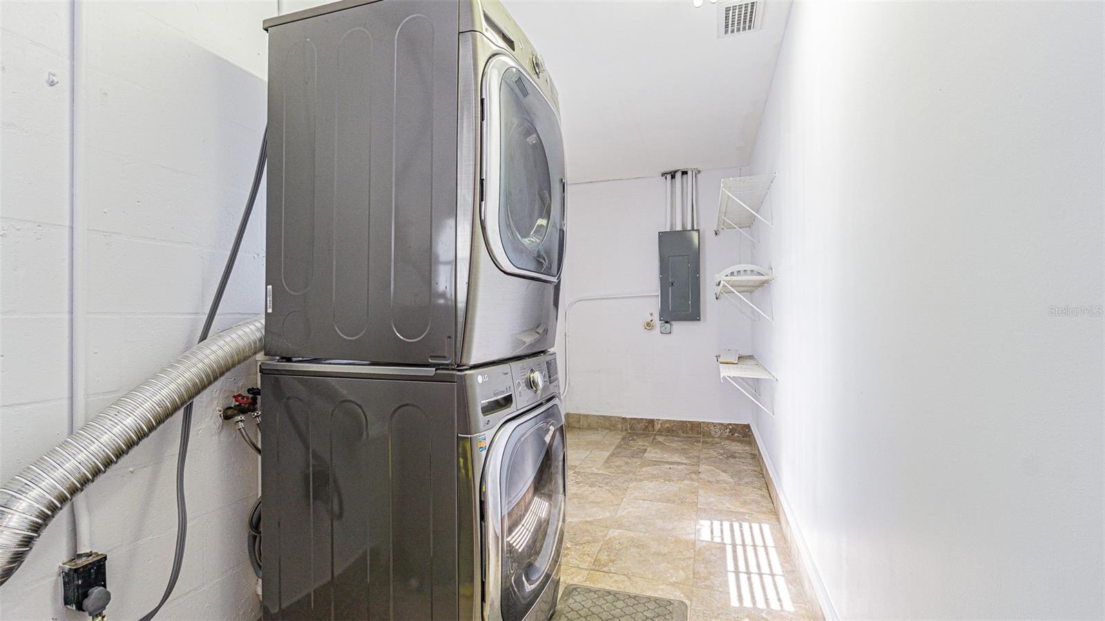 Laundry room with stackable LG washer/dryer