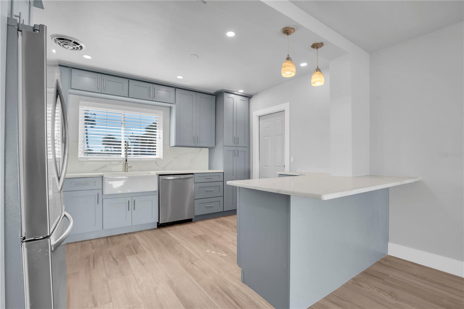 Experience the allure of the all new beautifully updated kitchen, complete with elegant recessed lighting, a inviting breakfast bar, and stunning stainless steel appliances that blend style with functionality.