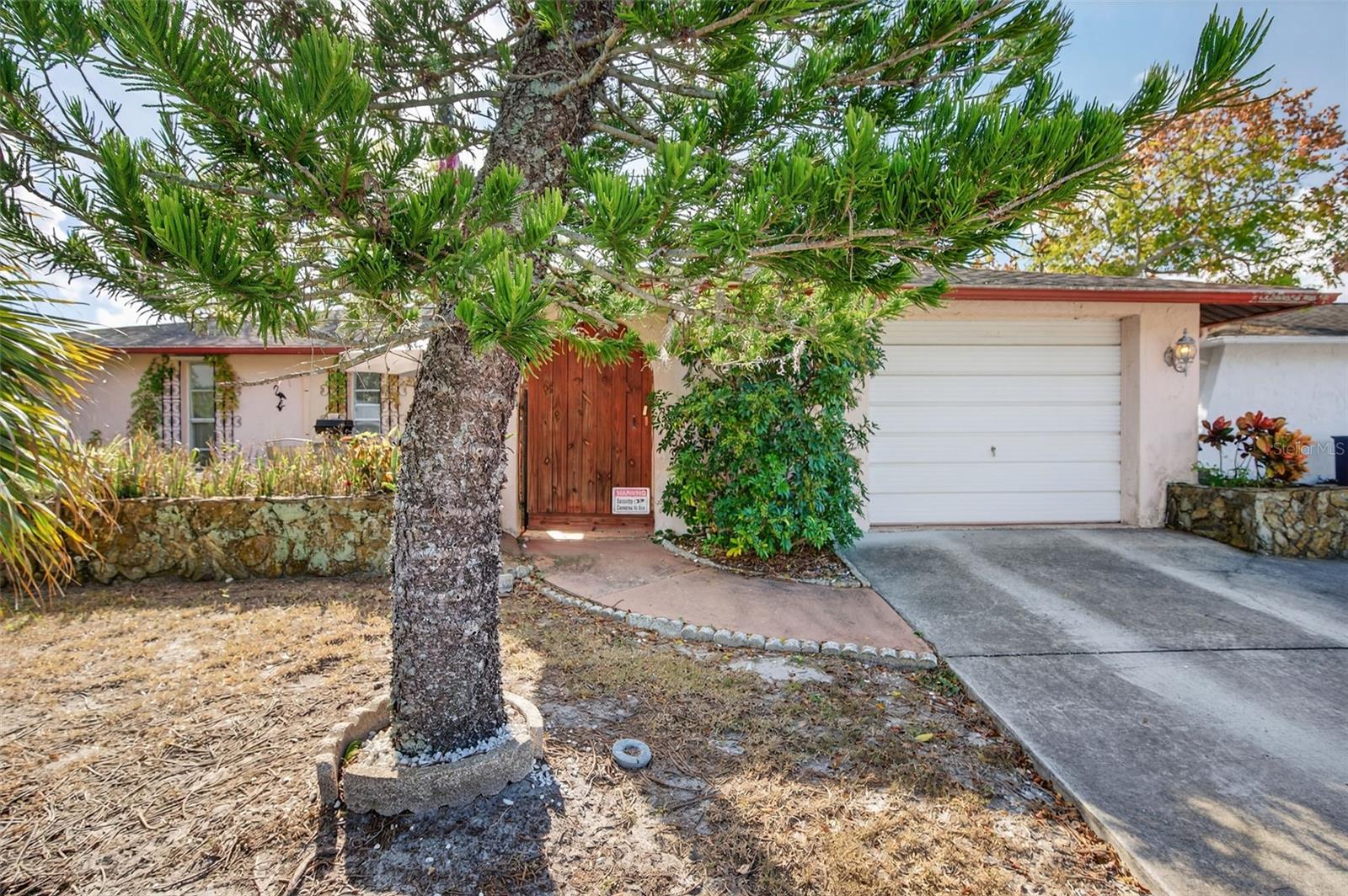 The home features an oversized 1 car garage
